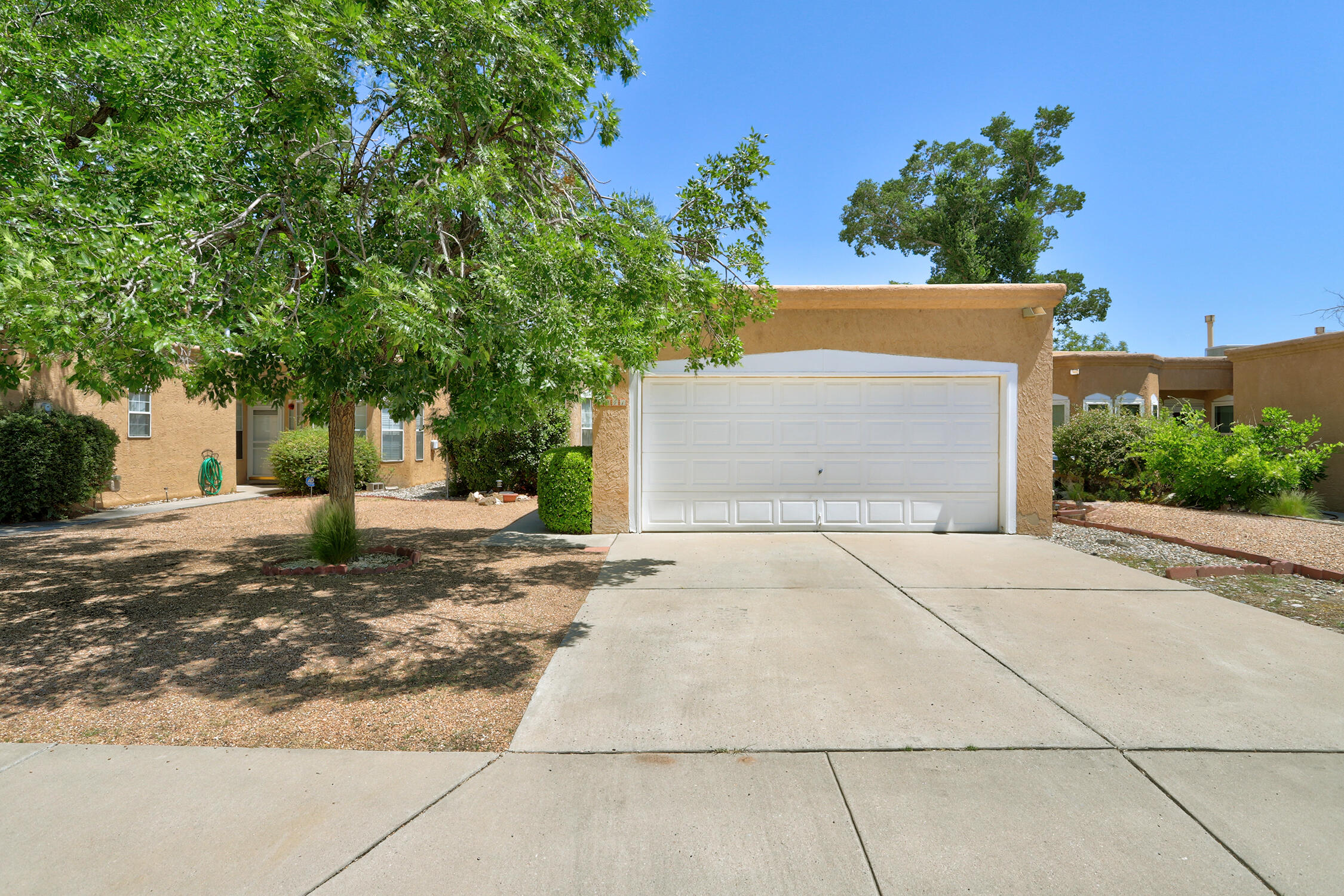 Beautiful detached home on a quiet cul-de-sac in the North Valley. Great location! This Home features an open and bright floor plan with a dramatic atmosphere created by a raised ceiling and cozy fireplace in the great room. The kitchen has granite tile counter tops. The living area is spacious with raised ceilings and a woodburning fireplace. There are clerestory windows in the living room and one bedroom to add light and charm. The roof, hot water heater, and cooler were replaced in 2022.  A charming breakfast nook ads space to the kitchen. It is Conveniently located near Rio Grande Nature Center, walking trails, I-40, shopping, and just minutes to downtown.  There is no HOA. Sunroom is 193 sq ft and is not included in sq ft.