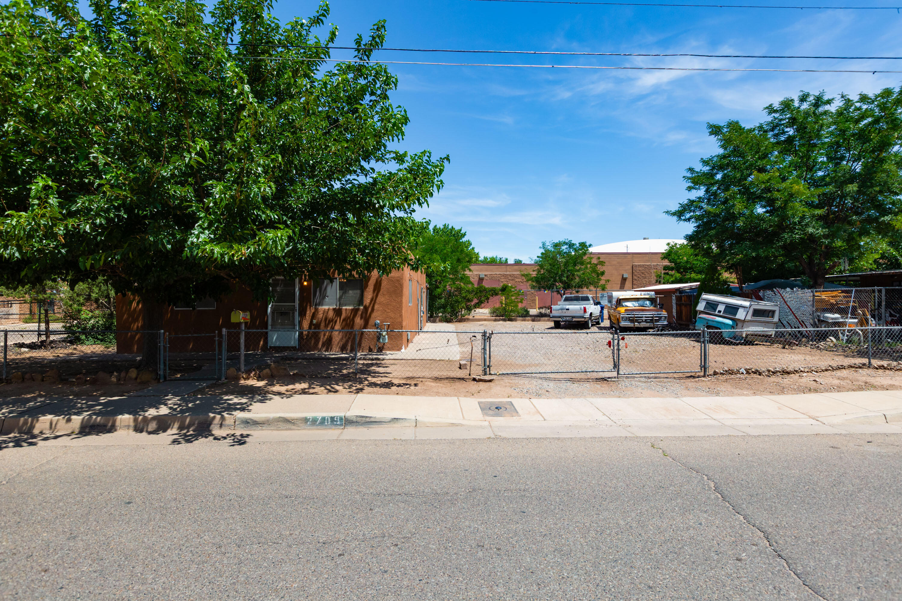 Located on a spacious corner lot in one of Albuquerque's most desirable neighborhoods, this 3-bedroom, 1 bath home offers a unique opportunity to bring your vision to life. The original adobe construction provides excellent thermal efficiency and timeless charm, while the generous lot allows room for larger vehicles, outdoor enhancements, or expansion potential. While the home needs updates, it features a newer roof still under warranty and recently replaced bathroom fixtures to get you started. With great bones and unbeatable location, this property is perfect for those looking to invest in a home with character and endless potential. Embrace the chance to make it your own in the heart of Duranes.