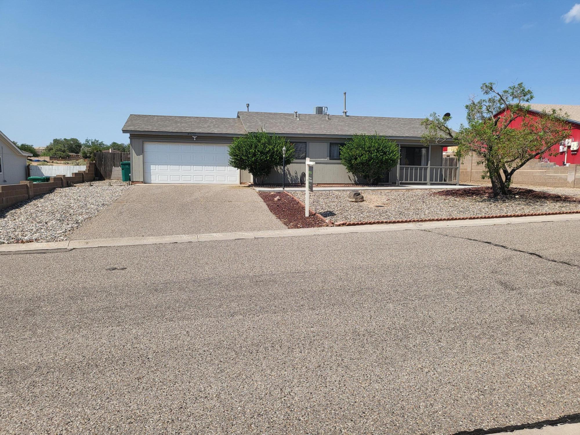 This beautifully updated home is move-in ready and packed with valuable upgrades. Brand new refrigerated air, new furnace, new carpet.  No poly pipes, new concrete slabs and walkways, freshly painted exterior (2021), new bathtub/shower (2021), new layer of shingles (2021), side yard access to .22 acre xeriscape backyard, fenced dog run, detached covered porch with electric power, water heater (2018).  Washer/Dryer and refrigerator convey.  Sunset  views of the Sandia Mountains await you!
