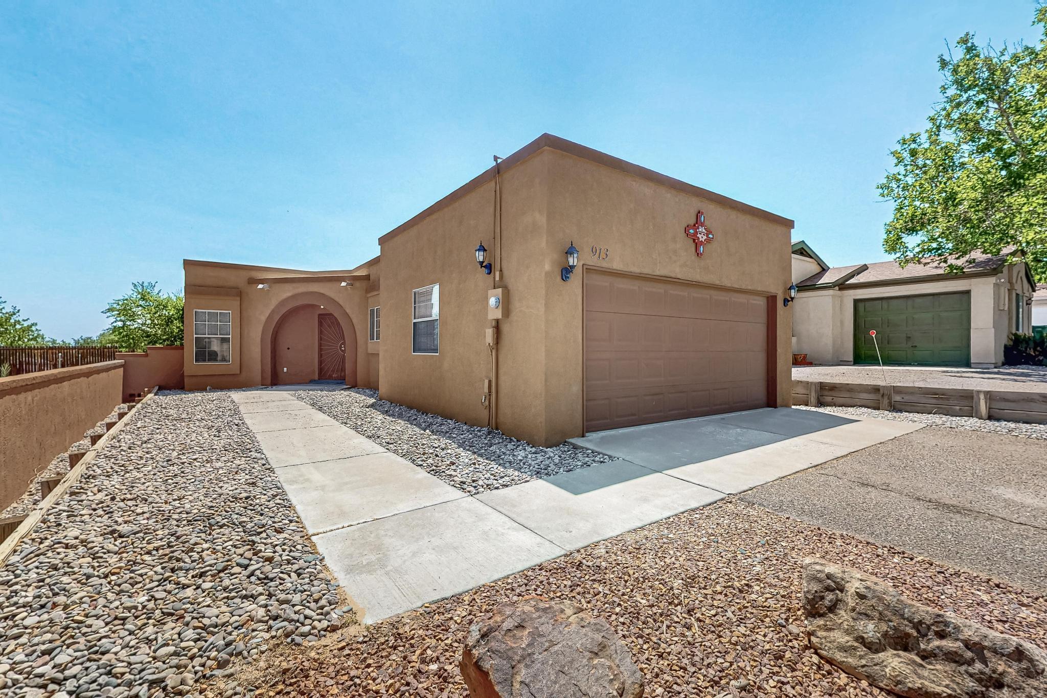 This is a fabulous two bedroom home with views of the Sandias. Freshly painted and clean as a whistle! It has tile throughout the home. In 2019 the heater/refrigerated air conditioner  and a water heater were installed. A new TPO roof in 2020. The Polybutlene was replaced in 2019. All kitchen appliances stay. The master suite also has views of the mountains and from the back covered patio. The family room opens to the patio for easy entertaining. It has a pantry, gas stove, refrigerator, dishwasher and microwave! Extra hall storage closets for coats, linens, etc. There is a finished 2 car garage to make this home complete. Make your appointment today to see this charming home.