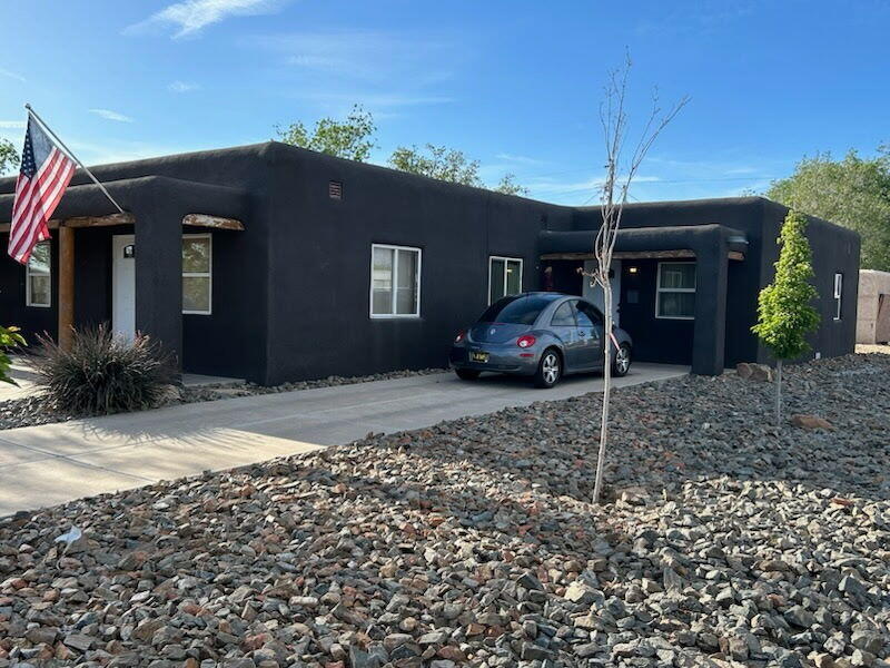 Corner lot duplex with quick access to Kirtland AFB, Sunport, and I-25.  Owner has been renovating both units, one unit is currently occupied and the other needs to be renovated.       Units have all NEW Plumbing w/Green Tags. Units have NEW Load Centers and Wiring. Granite Counters and Ceramic Tile adorn the kitchen and bath. Baths have Kohler Tubs. Recessed lighting in living and kitchen areas. Gas Forced Air w/Refrigerated AC. On-Demand Hot Water in front unit. NEW trees with irrigation. Rip-Rap landscaping rock gives a rugged feel and protection from unwanted foot traffic across property. NEW Roof. NEW Synthetic Stucco. NEW Doors and Windows.      Detached two car Garage faces Carlisle Blvd is not in use and can be repurposed into a small business.
