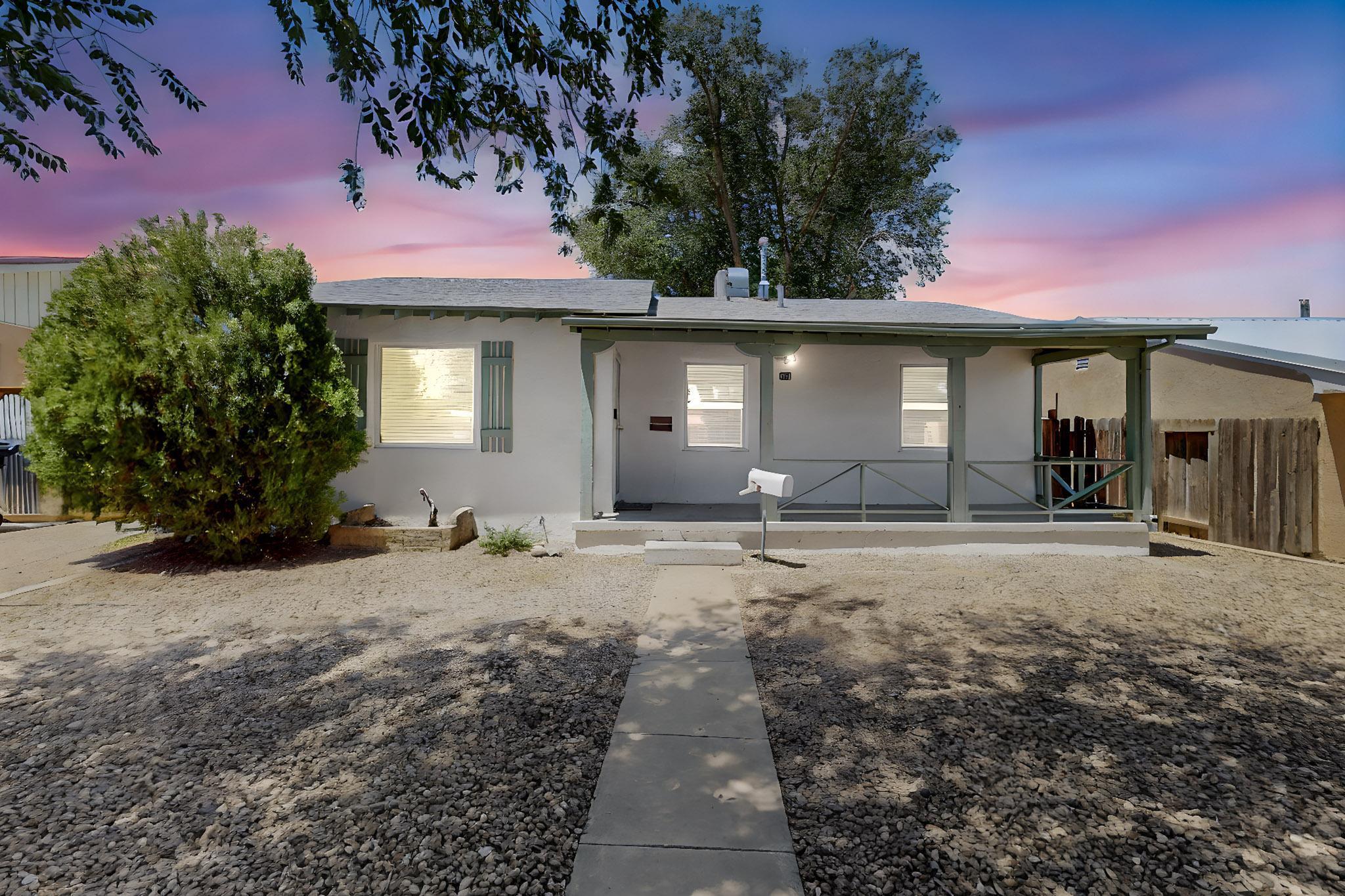 Discover your dream haven nestled near Kirtland AFB and Sandia Labs--where convenience meets charm.  Enjoy the mature trees that gracefully frame the home welcoming you inside. This 3&#8239;bed/2&#8239;bath gem greets you with warm wood floors and a freshly painted palette. The new kitchen shines with charming wood countertops, gleaming tile backsplash, and modern appliances. A chic half-bath adds ease and style. Imagine evenings in your expansive backyard where your imagination can roam free. 1 Car garage tucked in the back has many uses. Enjoy effortless access to shopping, dining, entertainment, and top-tier work hubs. Lovingly maintained, very well priced and seller is offering $5K for buyers to buy down the int. rate and save thousands or personalize the home with the savings. Welcome