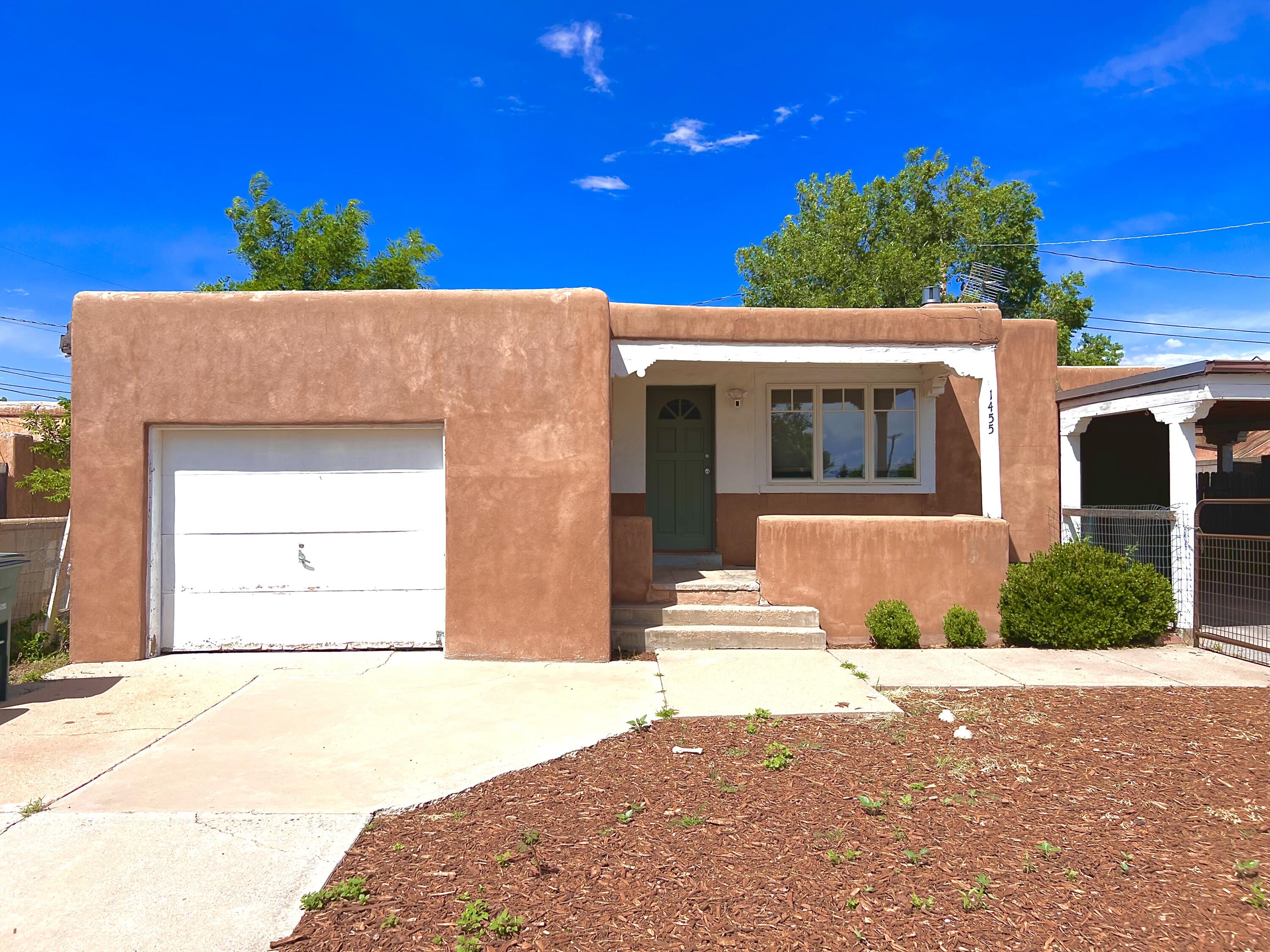 Discover your dream home just moments from Santa Fe Plaza! This beautifully quaint 3-bedroom, 2-bath residence offers classic Southwestern charm paired with comfort. Imagine mornings on your private patio overlooking the park, followed by a quick stroll to world-class galleries, gourmet restaurants, and vibrant cultural events. Inside, warm wood floors and abundant natural light create an inviting atmosphere. The spacious living room flows into a cozy kitchen with ample cabinetrya"a perfect backdrop for entertaining. Primary bedroom with en-suite and two additional bedrooms provide versatile space for guests or a home office. Additional living area/flex room found in semi finished basement. this property is ideal for those seeking convenience and authenticity. Schedule your showing today!