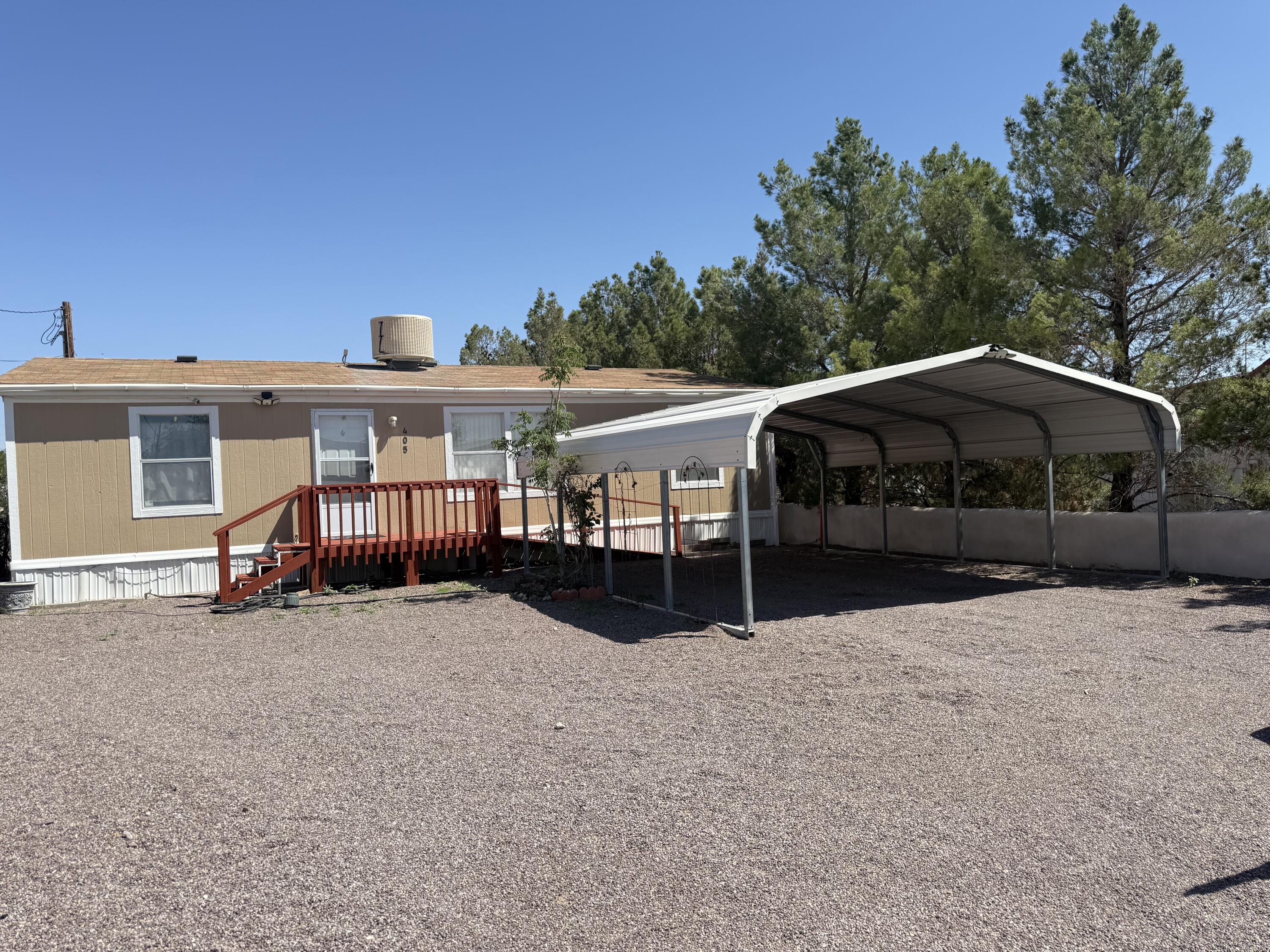 Immaculate, move&#8209;in ready 3&#8239;bedroom, 2&#8239;full&#8209;bath home on a generous 0.16&#8209;acre lot--designed for comfort, convenience, and charm. Wheelchair accessible throughout, it features a spacious two&#8209;car carport and a fully fenced backyard with an open deck--perfect for entertaining or enjoying enchanted New&#8239;Mexico sunsets. Beautifully landscaped from front to back, this property includes an outbuilding ideal as a workshop or creative studio. Inside, you'll find a seamless flow of carpeted bedrooms and vinyl&#8209;floored living spaces, and the home comes complete with all appliances. Located just minutes from New&#8239;Mexico Tech, this thoughtfully updated residence combines everyday practicality with serene, Southwestern beauty. Call listing broker today fo