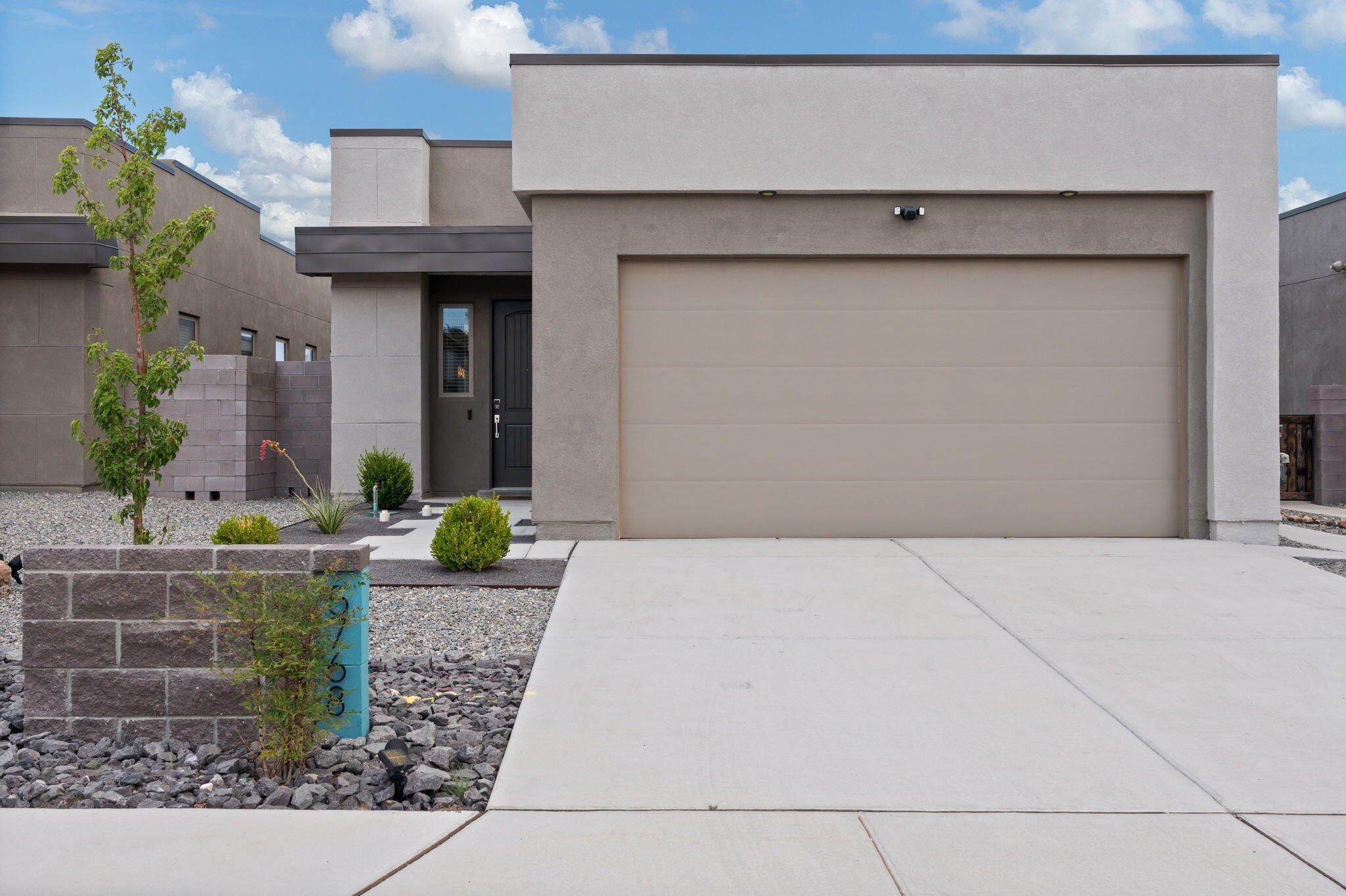 Welcome to this stunning single-story home that offers modern design & finishes throughout filled w/ natural light. W/ 3 BDRMS, 1.5 BA, & a 2-CG, this home provides ample space for comfortable living, entertaining, & relaxation. The open-concept floor plan seamlessly connects the living spaces. The kitchen is a dream, showcasing white cabinets, solid surface countertops, & a large kitchen bar. The primary suite is a serene retreat w/ a spacious bedroom, walk-in closet, & private en-suite bathroom, w/ tile surrounds & shower. The two additional bedrooms are generously sized. Enjoy outdoor living in your walled backyard w/ covered patio. Located in a friendly neighborhood w/ easy access to parks, schools, & shopping, this home is where comfort meets convenience. Don't miss this opportunity!