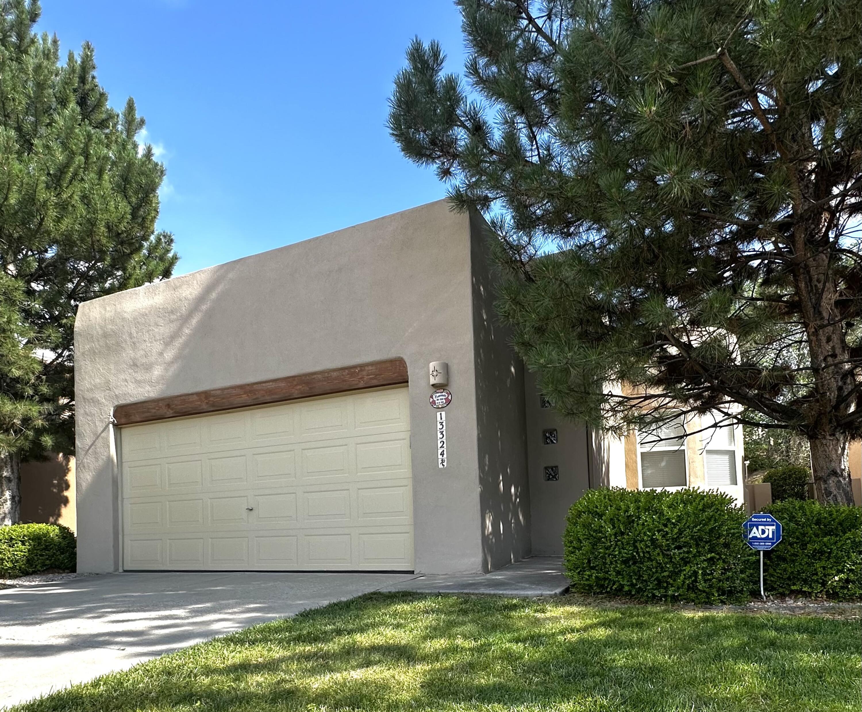 Just outside the views of the scenic Sandia Mountain range lies this stunning 3-bedroom, 2-bathroom home offering over 1,400 square feet of beautifully designedliving space. Its open floor plan creates an inviting and spacious environment, perfect for both relaxing and entertaining. High ceilings and multiple skylights flood the interior with natural light and enhance its airy ambiance. The Kiva Fireplace - a standout feature in the living room- serves as a focal point and conversation starter. The modern kitchen is equipped with stainless steel appliances, generous counter space and plenty of storage options. The primary bedroom is complete with an en suite bathroom and seamless access to the covered back porch. Two additional bedrooms are ideal for family, guests, or a home office!