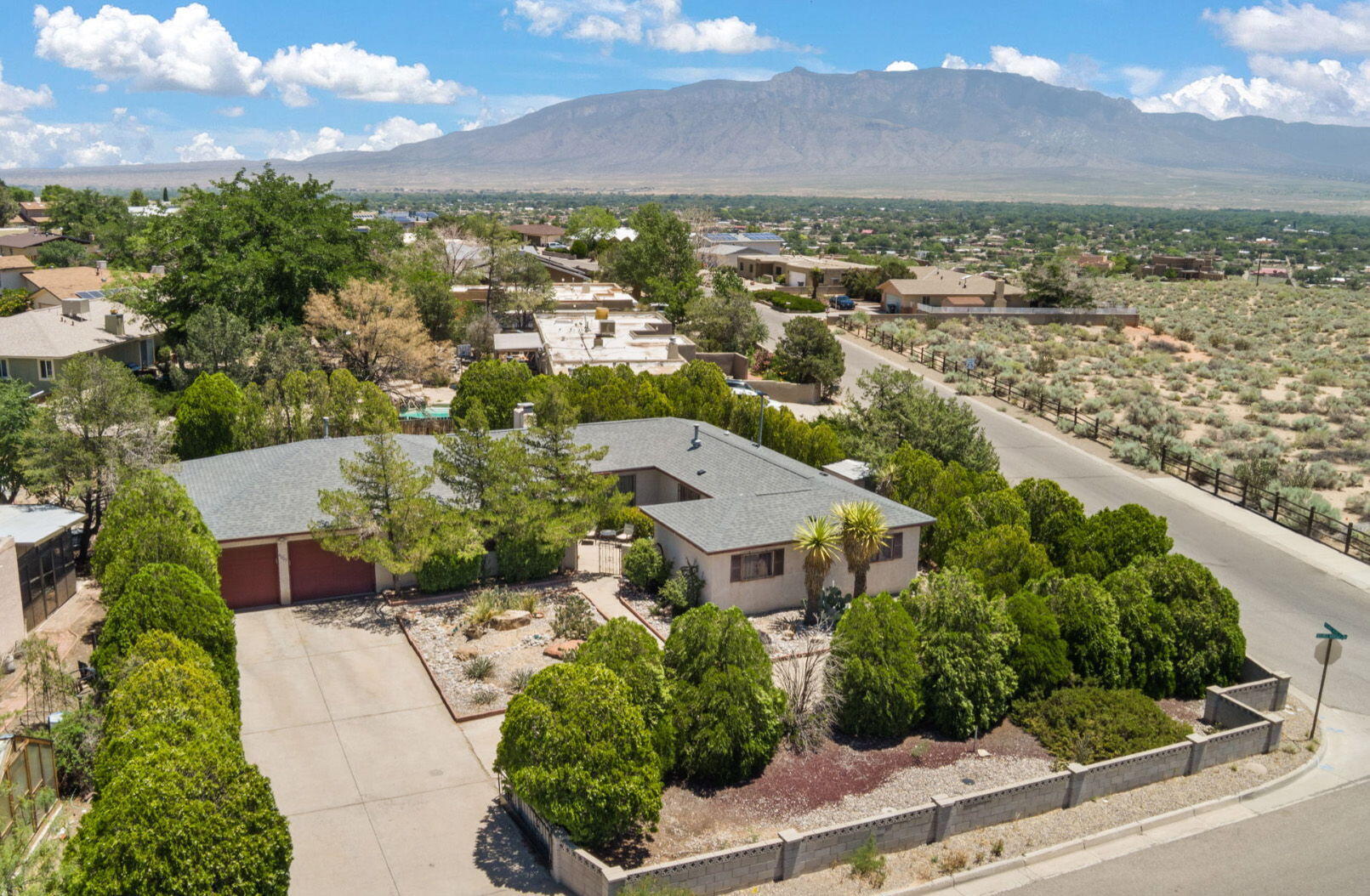 Great Location! Spectacular Views! Great School District and in walking distance to playground.  Check out the mountain views.  RV driveway and parking. Living Room and Family Room.  Huge laundry room. 2 Refrigerated Units(2018), Roof(2022), upgraded electrical panel.  Priced to reflect cosmetic deficiencies and deferred maintenance present.