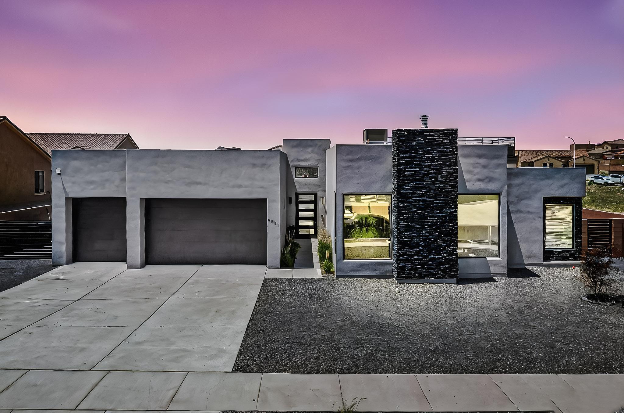 Pride of ownership shines in this spacious, amenity-rich home! With ample bedrooms, a bonus room, there's room for everyone. The gourmet kitchen features custom cabinets, quartz counters, a recessed sink, double oven and stainless steel appliances. Three en suite baths and a primary bath are filled with high-end finishes. Enjoy the outdoor kitchen, wet bar and fridge-perfect for entertaining. A wrought iron spiral staircase leads to the rooftop deck with stunning Sandia Mountain views. Side access and thoughtful details throughout complete this exceptional home.