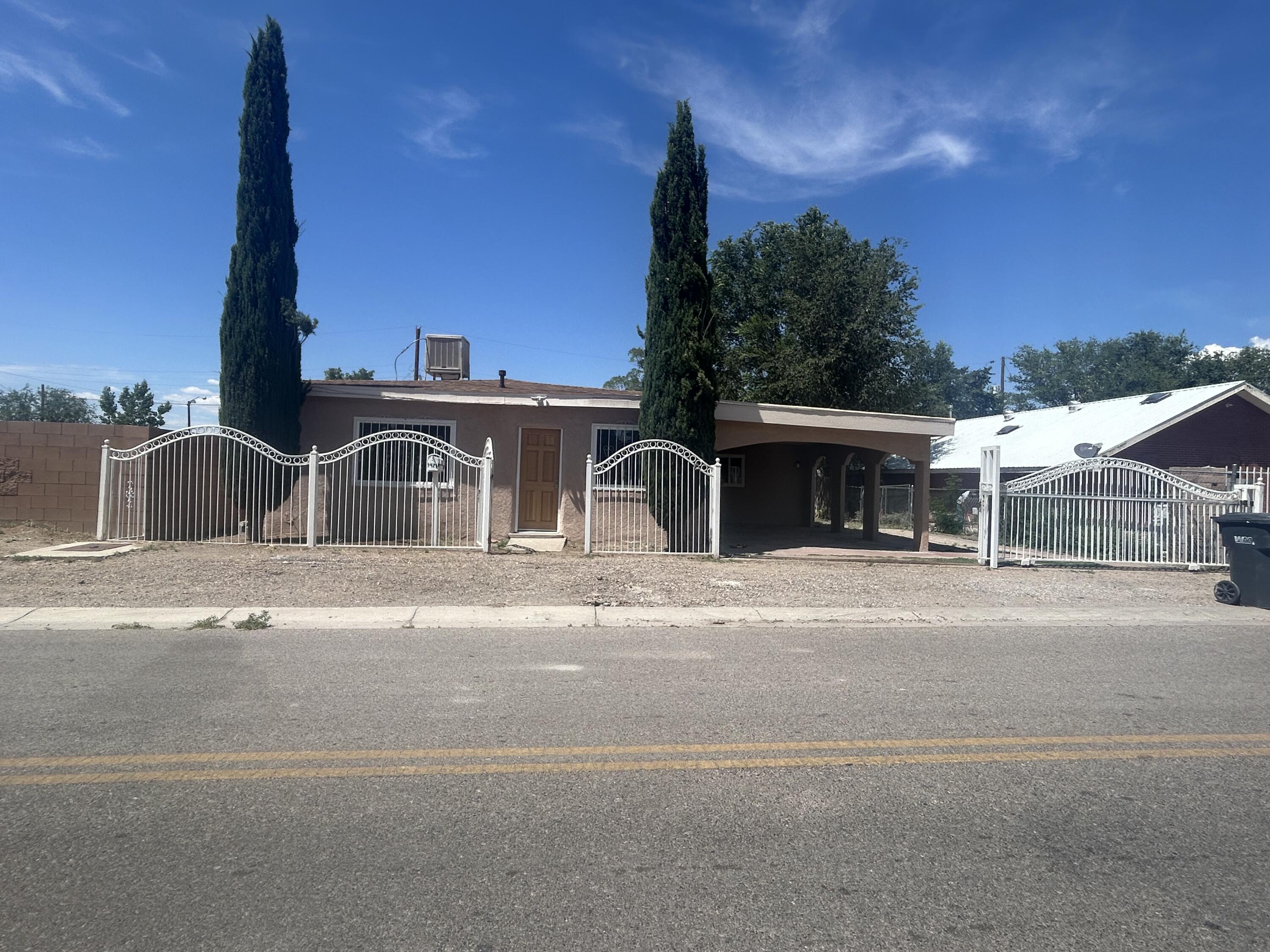 Charming 3 bedroom, 2 bath South Valley Gem. This property is move in ready. New roof, windows, paint, flooring, cabinets, counter tops, fixtures and much more. Security gate with backyard access. Home has an attached workshop, storage shed, and 2 covered patio's for comfort and entertaining. Priced below market to sell. Won't Last Long! Bring all offers!