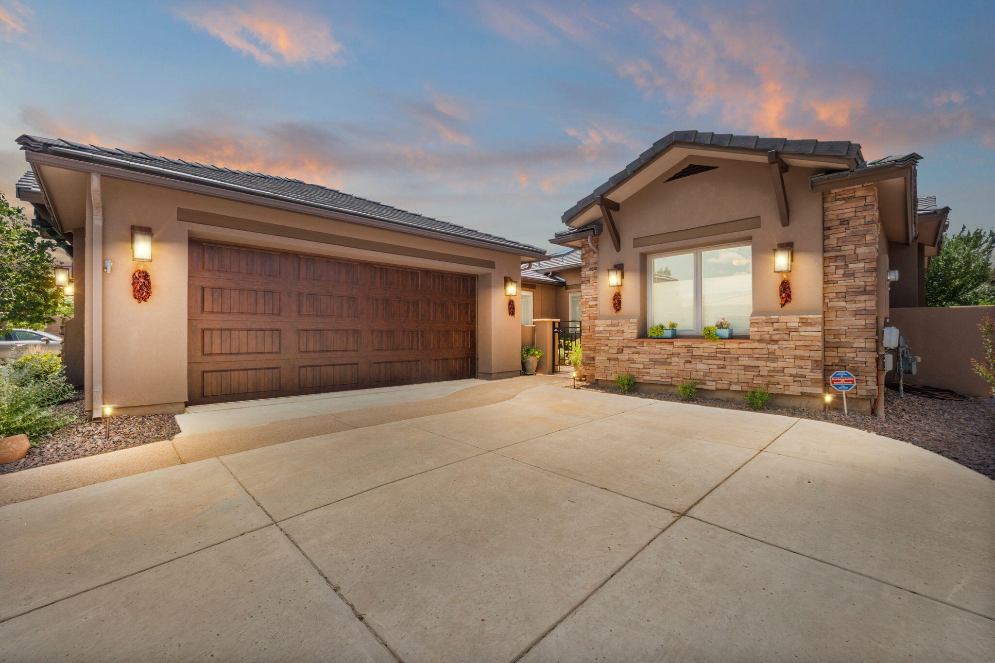 Rare opportunity to own this single story home in the sought after Gated Community, Glendale Estates! You're immediately greeted with stacked stone accents on exterior of the home, & your own private courtyard leading into the entry way. Walk into excellence with a custom front door & travertine tile on entry wall in foyer. This Model Home is an Energy Star/Green home that features stunning mountain & city views, with high end tile & wood floors, tall beamed ceilings and an open concept floorpan. Additional upgraded features include fixtures, crown molding, stacked stone gas fireplace, tall windows & tons of natural light.This home features 3 large bedrooms, an office, & a large bonus room with a separate mini split that could be used as another bedroom or Gym. Don't miss this opportunity