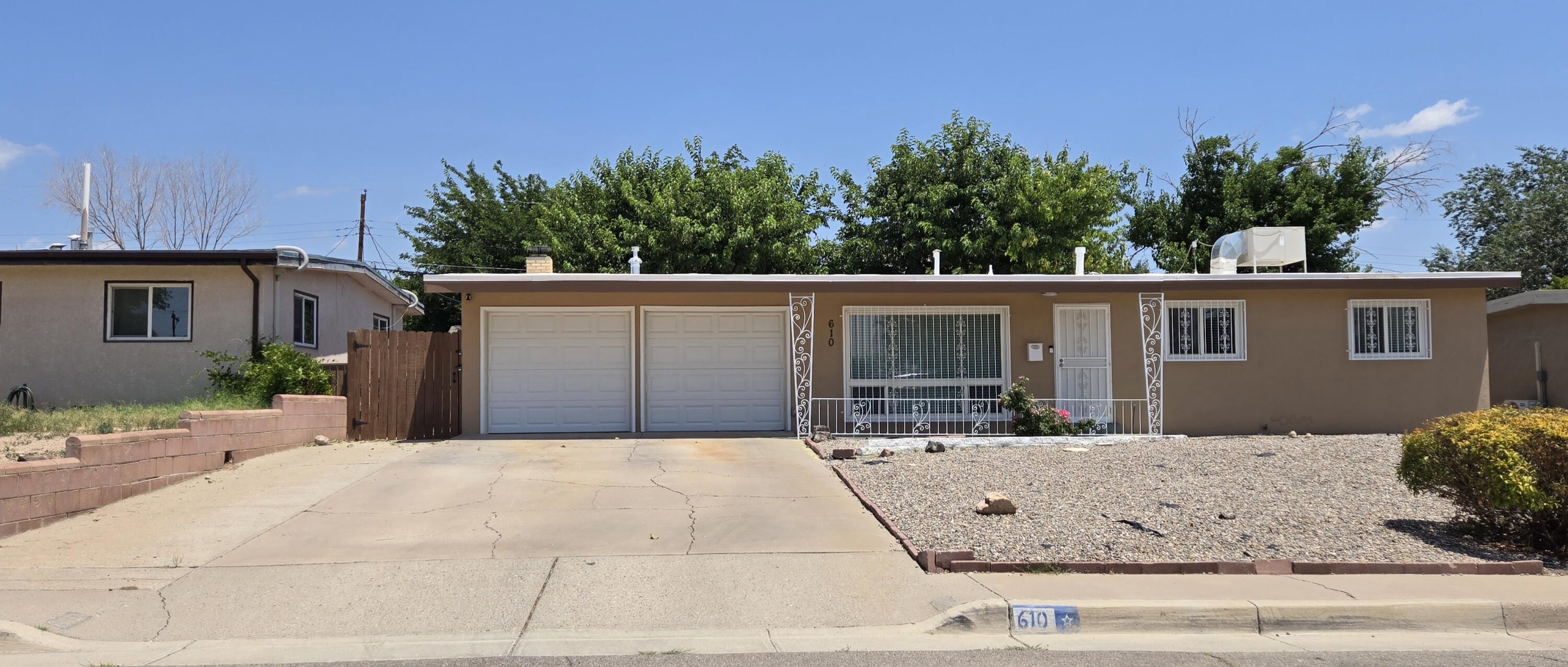 Such a treat! Renovated 3/2 home w/ 2 living spaces, 2 car gar, fireplace. All windows replaced, custom blinds, window iron & security screen doors front/back, TPO roof. Walk in to attractive laminate & tile flooring no carpet, kitchen & bathrooms have been updated. Kitchen has granite, island, white cabs, stainless appliances. Dining area is adjacent to the kitchen. 2nd living off the kitchen has a cozy fireplace & door to the backyard. Down the hall is the spacious coat closet, 3 bedrooms & full bath. Primary has a 3/4 bathroom with a shower, newer glass door, window. All bedrooms have ceiling fans/lights. Yards are landscaped, easy maintenance! Front is rocked w/ shrubs, back has grass, terraced, rocked w/ shrubs, trees. 2 sheds. Room for toys, pool & trampoline! Come see this beauty!