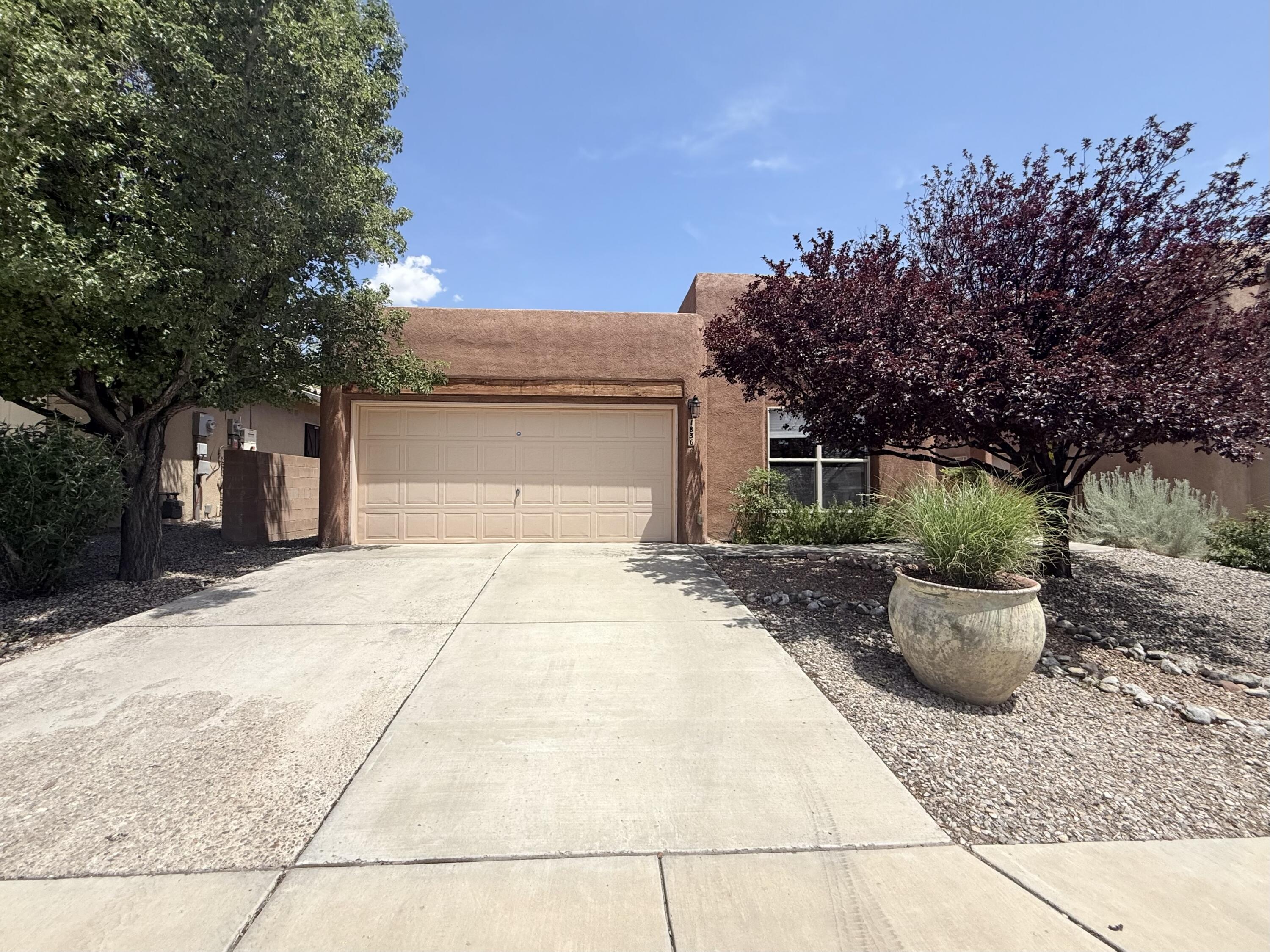 Welcome to Volterra. This beautifully updated 3BR + bonus room, 2BA home features new luxury vinyl floors, carpet, and custom built-in bookshelves. The kitchen is fully updated with a new range hood, dishwasher, and backsplash. All appliances stay! The primary bathroom has been updated, with a spa like feel. Enjoy an insulated workshop, irrigation system with timer, and updated light fixtures/ceiling fans. Located in a private neighborhood with walking trails, ABQ Open Space, a children's park, dog parks, and close to Manzano Mesa Center, pickleball courts, I-40, foothills, Sandia Labs, and Kirtland. Make this home yours today!