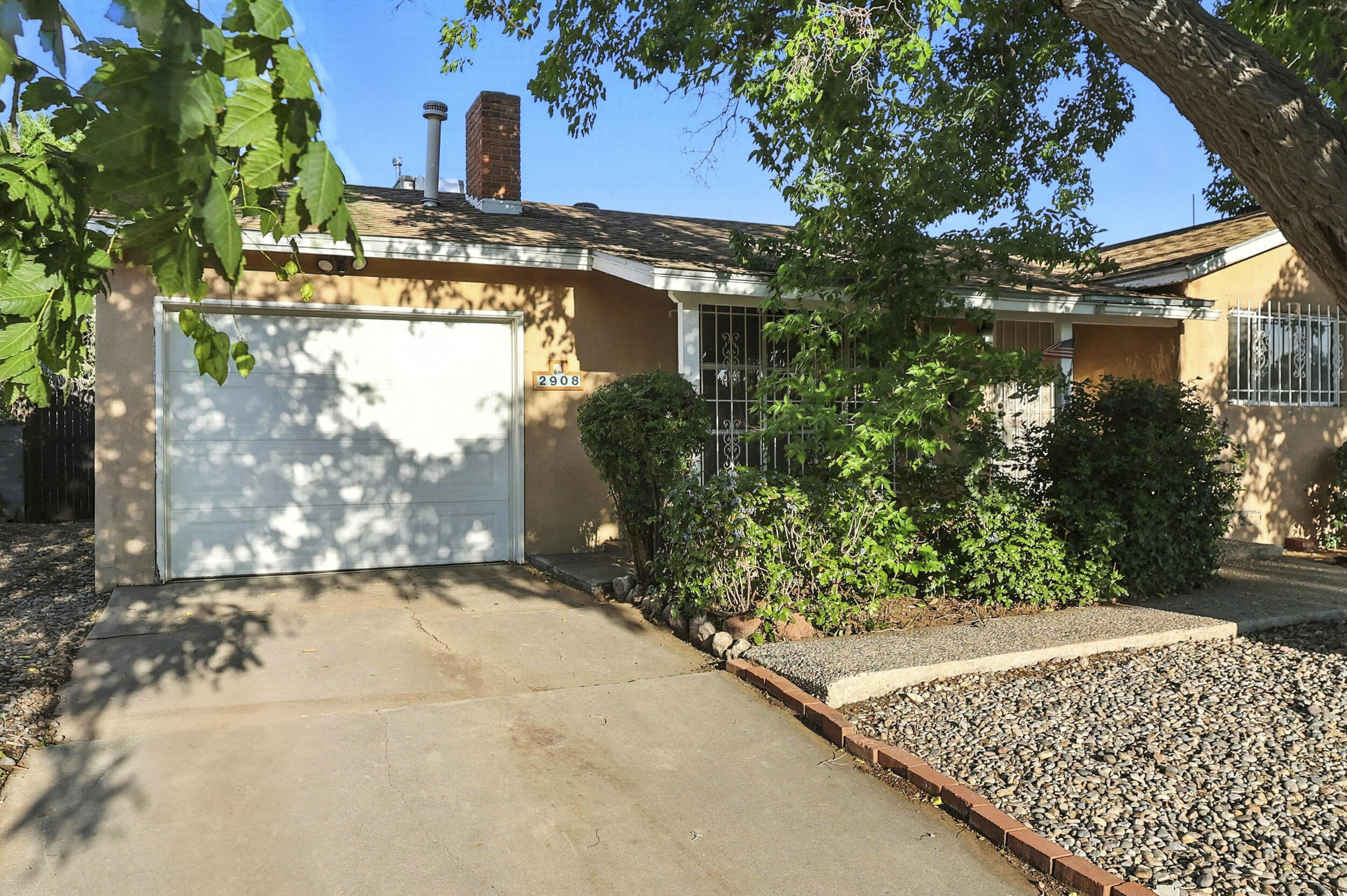 Incredible opportunity to own this well-maintained, Mossman-built gem in the NE Heights!This charming 2 bed/2 bath, single-story home offers timeless quality and character in a quiet tight-knit neighborhood. Kitchen offers spacious cabinets with a charming look. Wood floors run throughout, including beneath the carpeted bedrooms presenting an amazing opportunity to refinish and have quality original wood floors throughout the entire home! Enjoy easy access to Albuquerque's desirable Uptown area--minutes from premier shopping, restaurants, and nightlife. With only a few owners over the years, this home has been lovingly cared for and preserved. Includes a 1-car garage, established landscaping, and vintage charm throughout. Don't miss this incredibly cute, move-in-ready home!