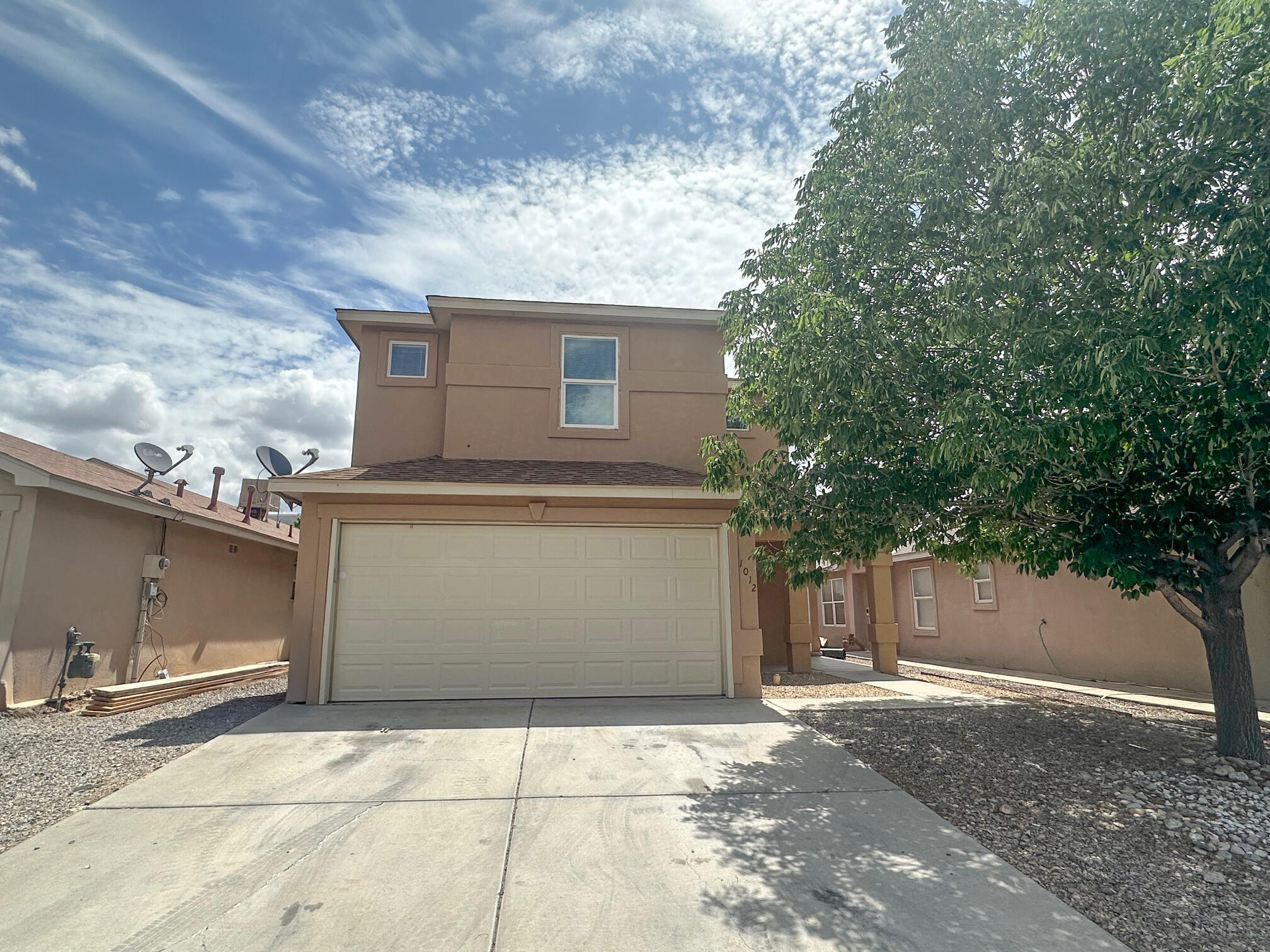 Welcome to your new home! This two-story property offers 3 bedrooms upstairs, 2 full bathrooms and one-half bath. The living area feels spacious and bright with high ceilings. The open kitchen features an eat in area and plenty of pantry space. Some recent updates have been completed including carpet, paint and a new roof (June 2025). Nice backyard to enjoy the sunny New Mexico weather. Located close to shopping and dining along Coors and easy access to the freeway for a quick commute.