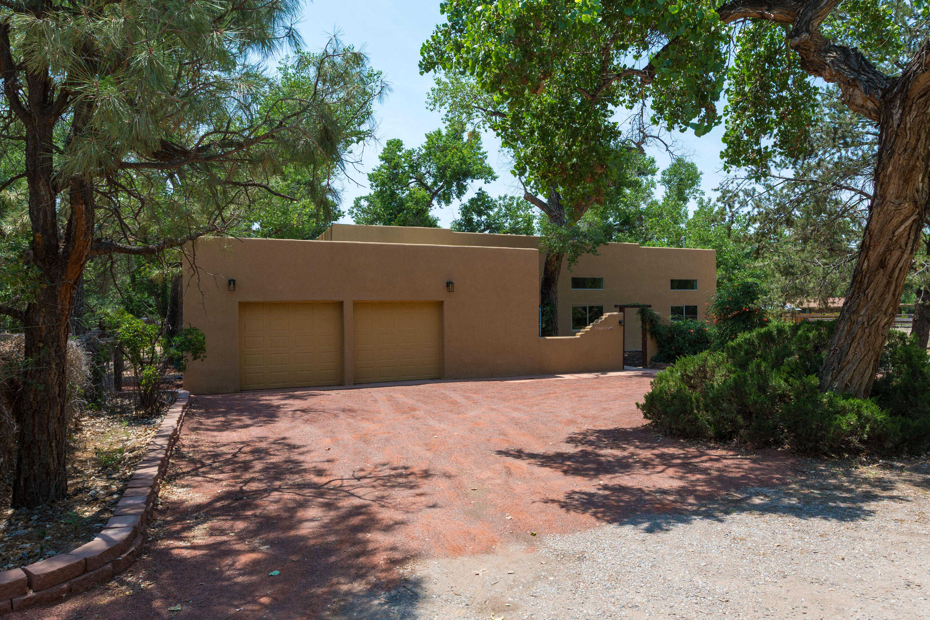Old world charm meets modern convenience!  This home was taken down to the studs and reimagined from the ground up. Offering all the sophistication of new construction with the soul of classic NM  southwest design. Enjoy rich Vigas, warm brick floors and timeless architectural details seamlessly pared with modern comforts and high end finishes. Delivering a home that is as beautiful as it is livable. Refrigerated air conditioning for summer comfort*Gourmet kitchen offers granite counters and rich dark wood cabinetry, pantry and a stylish coffee bar and/or work station.  2 inviting sunrooms perfect for extra enjoyment* all on a fenced 1 acre lot with barn and pasture ideal for horses or your dream country retreat yet close to all amenities. Includes Irrigation well for your landscape needs