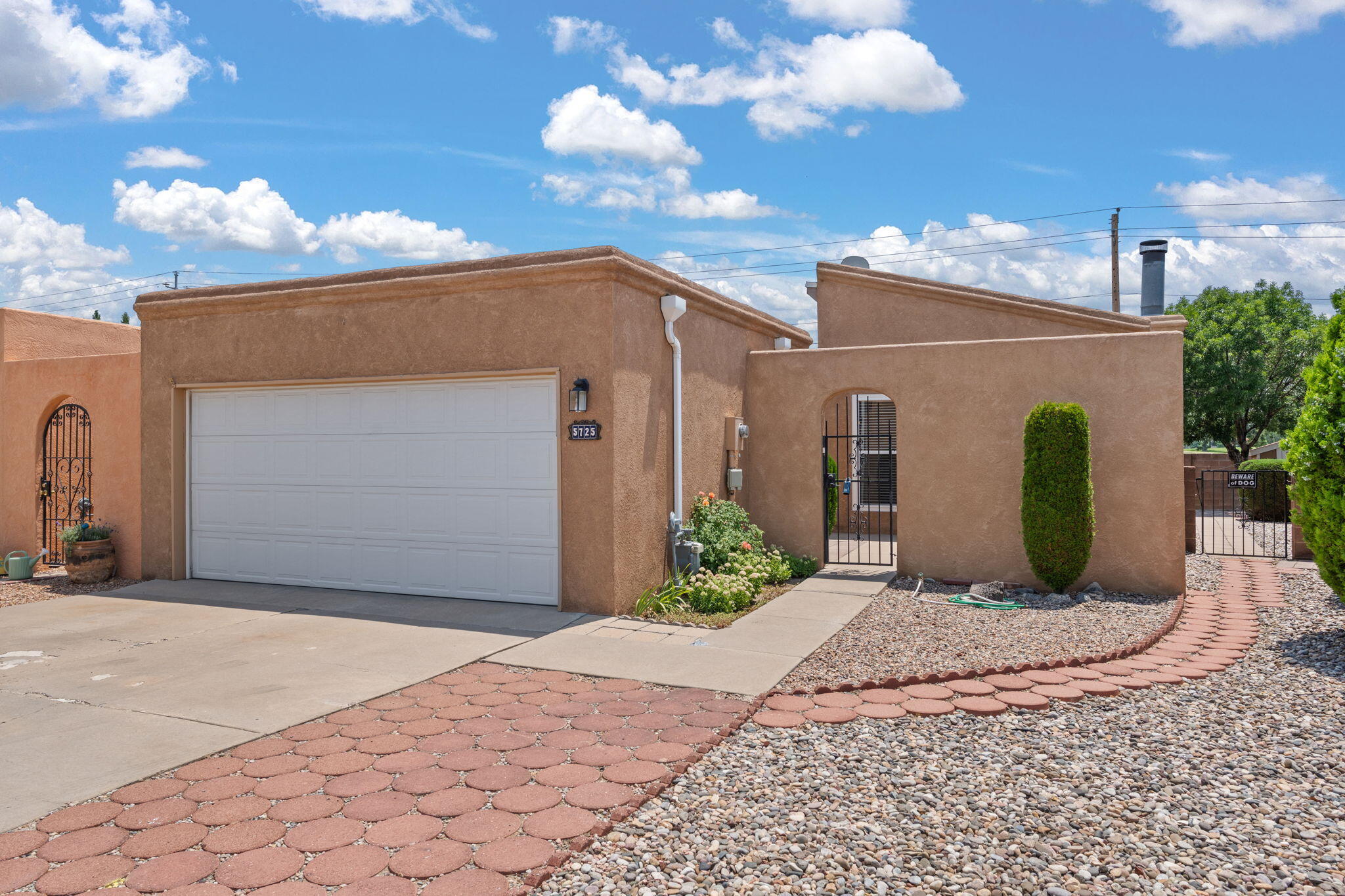 Immaculately maintained and move-in ready, this charming 2-bd, 2-ba, one-story home in the highly desirable Academy West neighborhood offers comfort and style. NO HOA! With 1,400 square feet of thoughtfully designed living space, the home features spacious walk-in closets, a two-car garage, and beautiful newer luxury vinyl flooring. Recent upgrades include energy-efficient windows (2017), interior repainted (2025), fresh stucco (2022), and a new patio door (2023), Please see the attached updates list for a full list. The open-concept layout flows seamlessly to the backyard, where you'll enjoy serene golf course views of the Arroyo Del Oso golf course-- perfect for entertaining or quiet relaxation. Schedule your private showing today -- homes this well cared for don't last long!