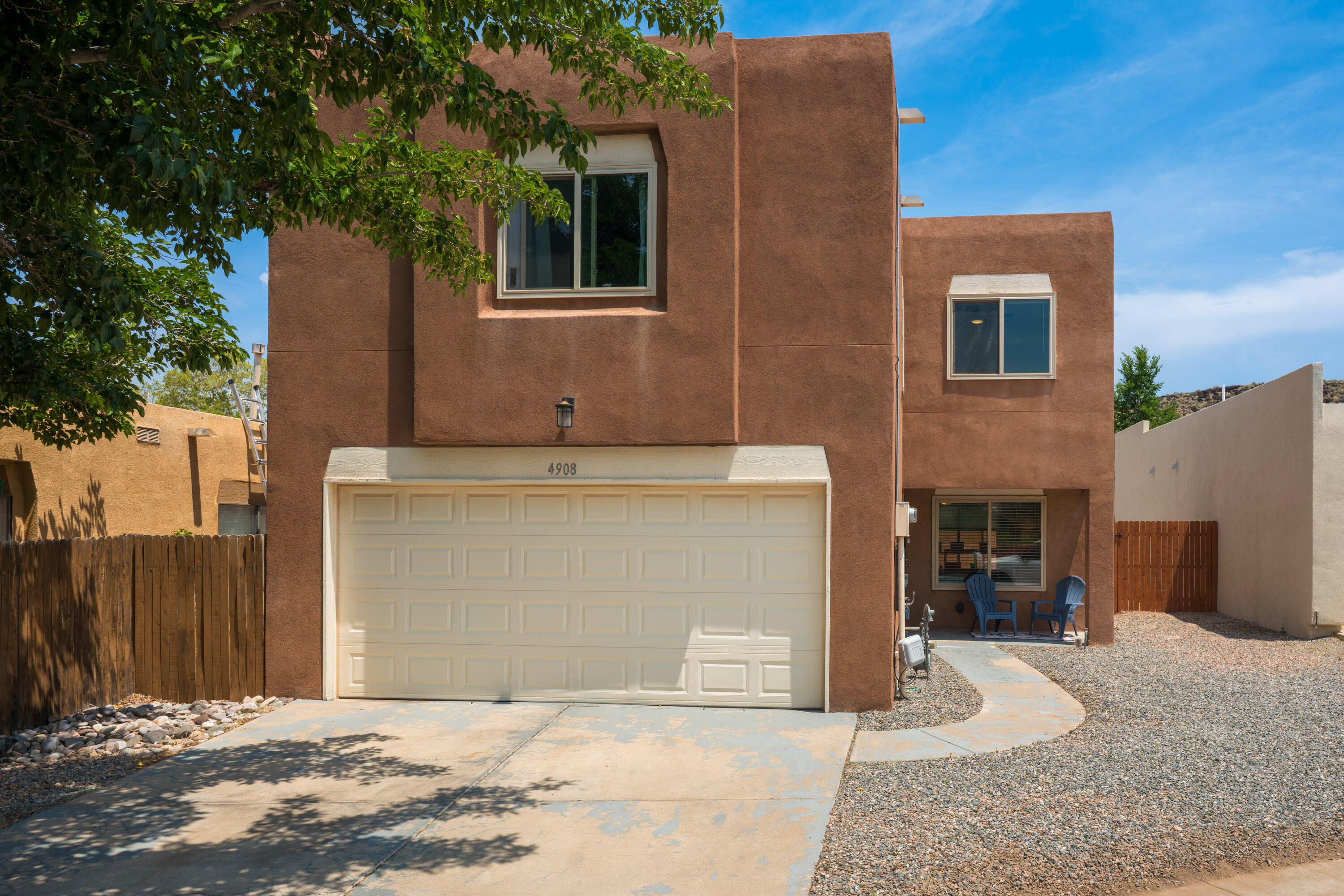 Welcome to your next home near the Petroglyph trails! This charming 2-story offers a smart 3-bedroom, 2.5-bath layout in a peaceful neighborhood just minutes from Montano and I-40. Downstairs features an open-concept living and dining area with easy-care vinyl flooring, while the upstairs offers three spacious bedrooms and plenty of natural light. Step outside to a generous backyard with raised garden beds, brand-new fencing, and space to play, relax, or entertain.Major updates have already been done for you -- including a newer HVAC system, upgraded electrical panel, primary bath tub & NO poly plumbing -- all within the last four years! Whether you're an outdoor adventurer or a daily commuter, you'll love being just steps from Petroglyph hiking trails and close to major river crossings