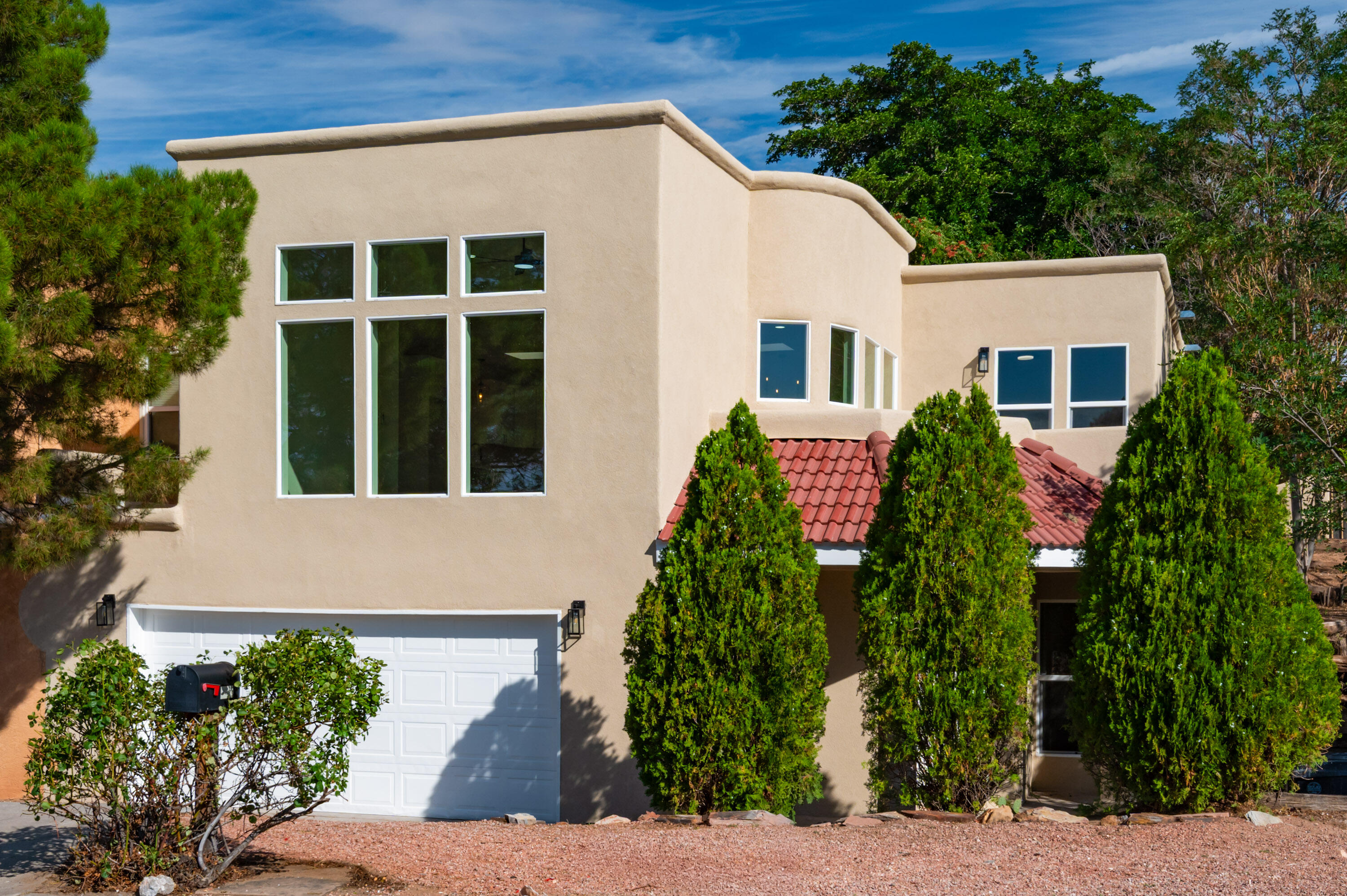 This home is basically New Construction. Everything is new. List of New items: TPO Roof, windows, stucco, HVAC, water heater, furnace, Refrigerated air, Doors, Garage door opener, electrical, Interior paint, flooring, bathrooms, kitchen, lights and appliances. Absolutely gorgeous remodel! 3BR, 3 Bathrooms, 2 car garage and yard space. Wonderful neighborhood. Turn key home.