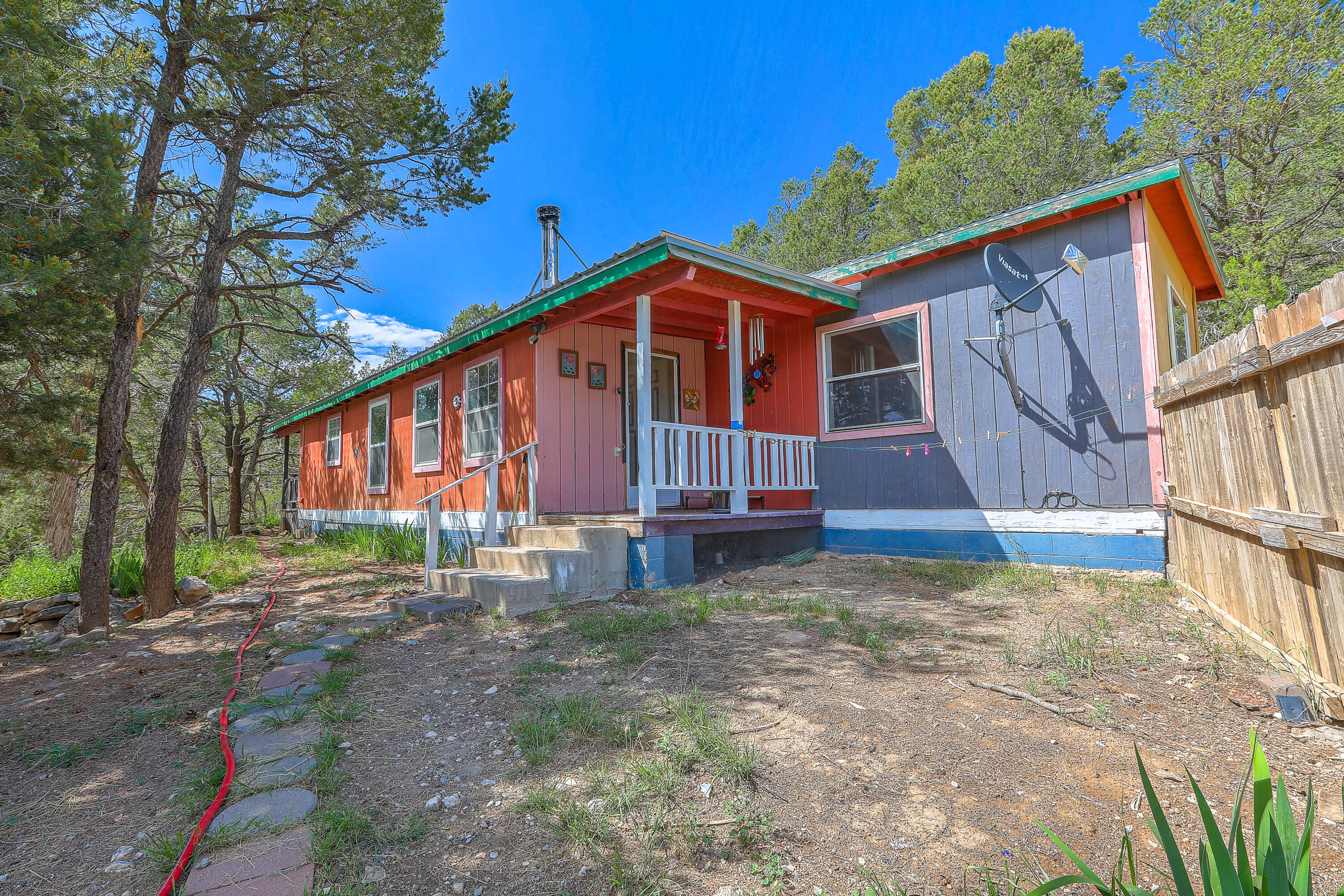 Very cute updated home on 1.14 Acres of wooded land. All you really need for country living. Includes well and septic and a small permanent shed.  This property is being offered as Owner Financing or Cash options only.