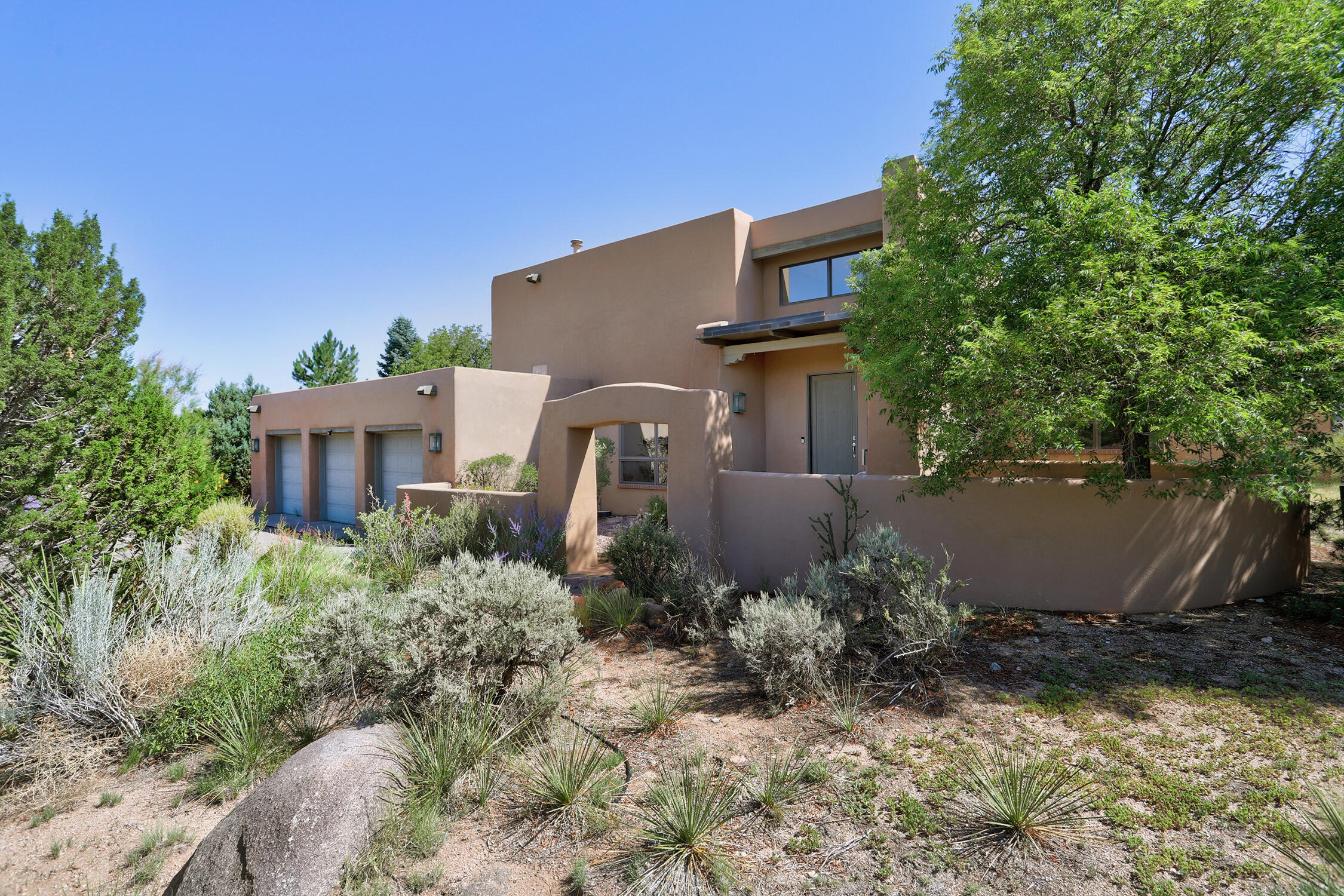 Open House Sunday 7/20 From 1 pm to 3 pm * Stunning Sandia Mountain Views Have to Be Seen In Person to Appreciate! * Very Private Custom Home Is Perfectly Sited to Take Advantage of Views in Several Directions * Beautiful Design Feels Anchored to the Land * Lush Back Yard and Cool Courtyard with Swimming Pool, Hot Tub, Built-In Grill, and Fireplace * Double Height Entry Filled with Light * Beamed and Decked Ceilings * Pella Windows * Recently Updated Kitchen with Island and Stainless Steel Appliances * Three Nice Sized Bedrooms on the Main Level * Large Primary Suite Upstairs with Walk-In Closet, Separate Tub, Separate Shower, and Dual Vanity * Large Laundry Room with Storage * Wonderful Three Car Garage * Radiant Heat * Two Living Areas * Call Your Realtor(r) Today for a Private Showing!