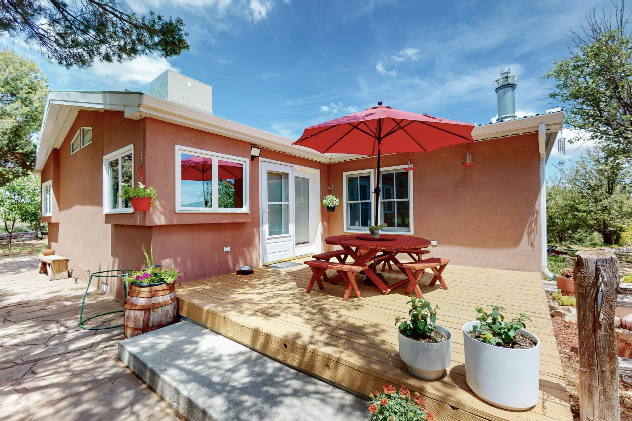 Experience peaceful rural living on 20 breathtaking acres in Edgewood, NM--plus an additional 30 acres available! This 4-bed, 2-bath home features a newer roof, fresh stucco, updated windows, and is part of the coveted Entranosa Water System. Step inside to granite countertops, large pantry, multiple living areas, wide hallway, and a private office. Patios off the kitchen, office, and primary bedroom open to a landscape of rolling meadows, whispering pines, and endless skies. Breathe in crisp, pine-scented air as you explore your own trails, surrounded by songbirds, deer, and serene pastoral views. Just minutes from I-40 and within walking distance to Route 66 Elementary school, this move-in ready retreat is a true sanctuary of space, beauty, and natural wonder.