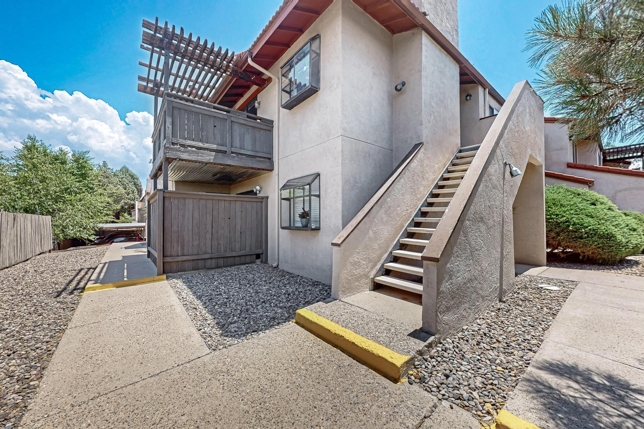 Welcome to this charming 2-bedroom, 1-bathroom condo nestled in Albuquerque's desirable North East Heights.  This well-maintained home features a bright and functional layout, a cozy living area, and a private patio space. Fresh Paint and Flooring.  Enjoy the convenience of one covered parking space, along with access to a community pool and clubhouse. All located in a quiet, established community close to shopping, dining, parks, and trails.