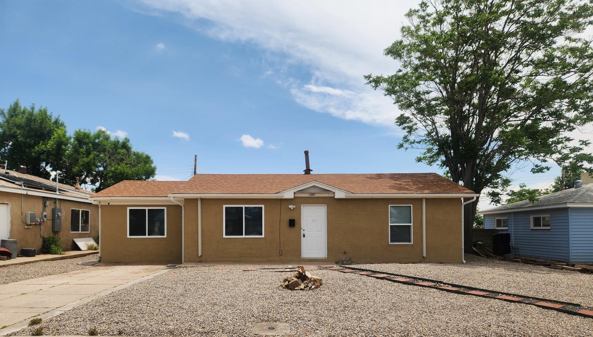 Darling recently updated 3 Bedroom in NE Heights Hoffman Park Area!  Home features fresh paint, bathroom with newer vanity and tile. Open kitchen with granite countertops and stainless-steel appliances. Stacked washer and dryer - mini splits throughout the property. Covered patio on back. Walking distance to parks and schools.