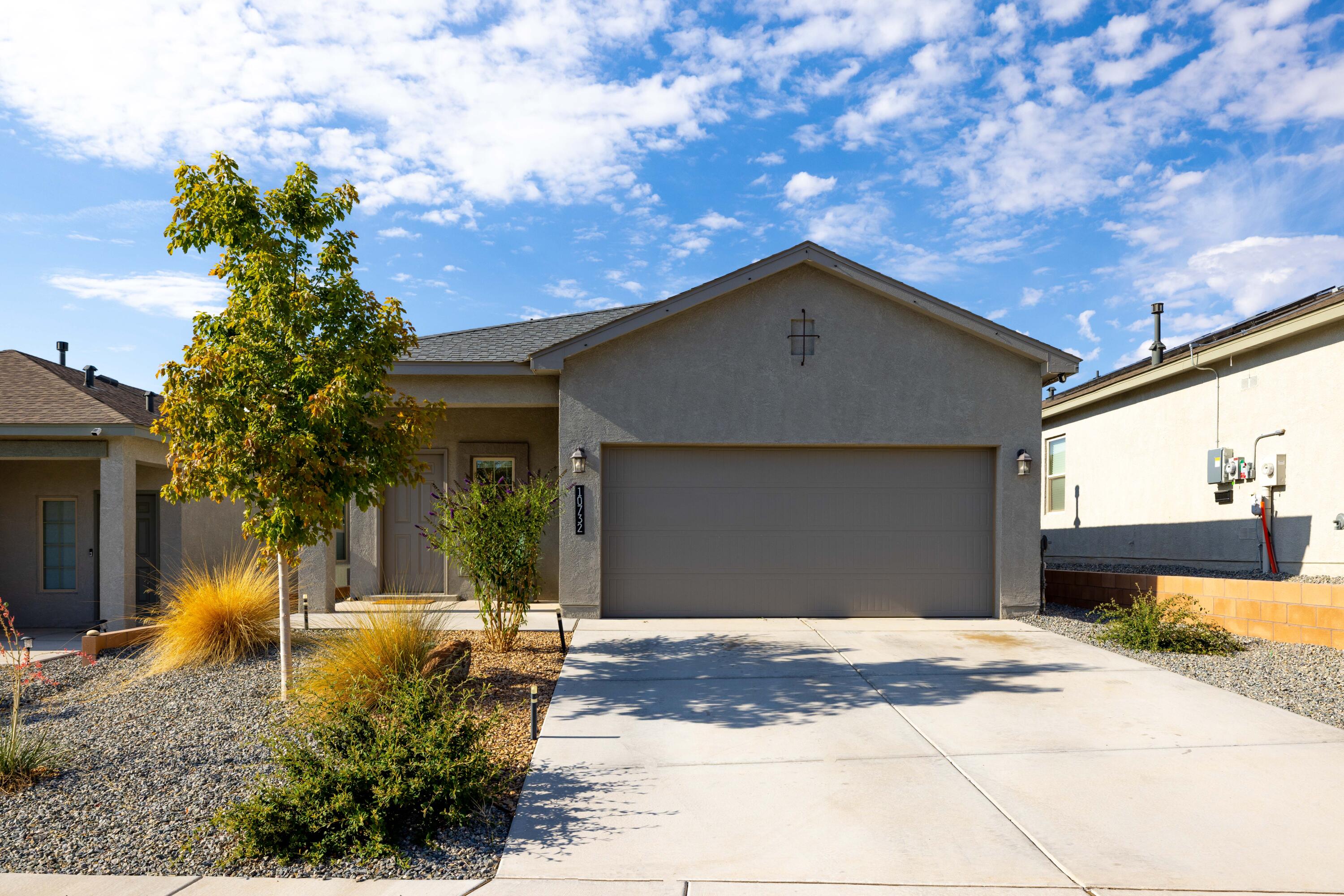 Welcome to 10732 Caresso Loop SW - a stunning newer home in a secure gated community! Step inside to a bright, open layout with modern finishes, a spacious kitchen with stainless steel appliances, and plenty of room to gather with family and friends. The beautifully finished backyard is your private retreat--perfect for BBQs, relaxing evenings, or morning coffee. With 3 bedrooms, 2 baths, and a prime location near shopping, parks, and I-40, this home has it all. Come fall in love!