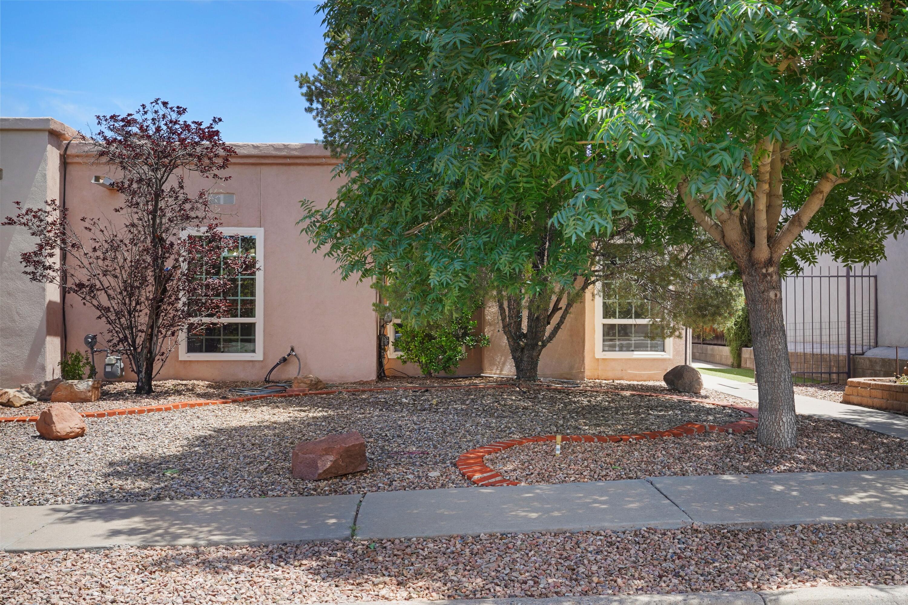 Fantastic location in a highly desireable area! This spacious 1,710 sq ft townhome offers 3 bedrooms and 1.75 baths. Enjoy a cozy formal living room with a wood-burning fireplace, separate dining room, and a bright bonus room perfect as an office. The primary suite features backyard access, dual sinks, spa shower, and walk-in closet. The kitchen is generously sized with new cabinets, counters, and flooring (2025).Other updates include: new HVAC (2024), newer carpet, LVP flooring, and refreshed baths. Outside, enjoy low-maintence landscaping, mountain views, a beautiful mature peach tree, red and white grapes, and a private block-fenced yard with a covered patio.