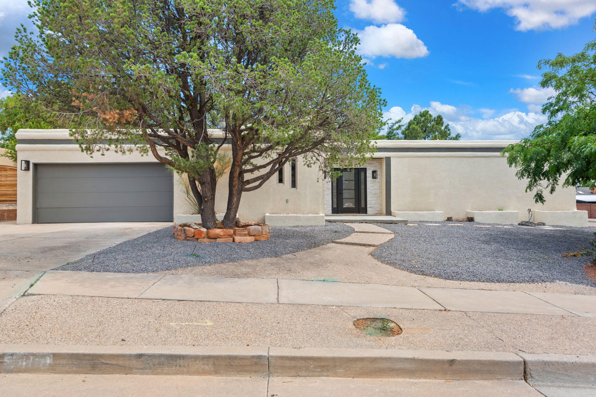 Welcome to 9400 Admiral Lowell NE! Located in the highly sought-after Academy Hills Neighborhood, this beautifully remodeled home offers the perfect combination of comfort, style, & modern living. Featuring 4 beds, 3 baths, & 3100 sq ft of open living space. The thoughtfully designed living areas are truly unique! The oversized, private corner lot has backyard access, a garage door in rear as well to drive thru onto a large concrete pad with basketball hoop & room for boat or RV parking. Minutes from Hubert Humphrey Elementary, Whole foods, Mountain Run Shopping center, Academy Hills Park, & much more! Scheduled your tour today!