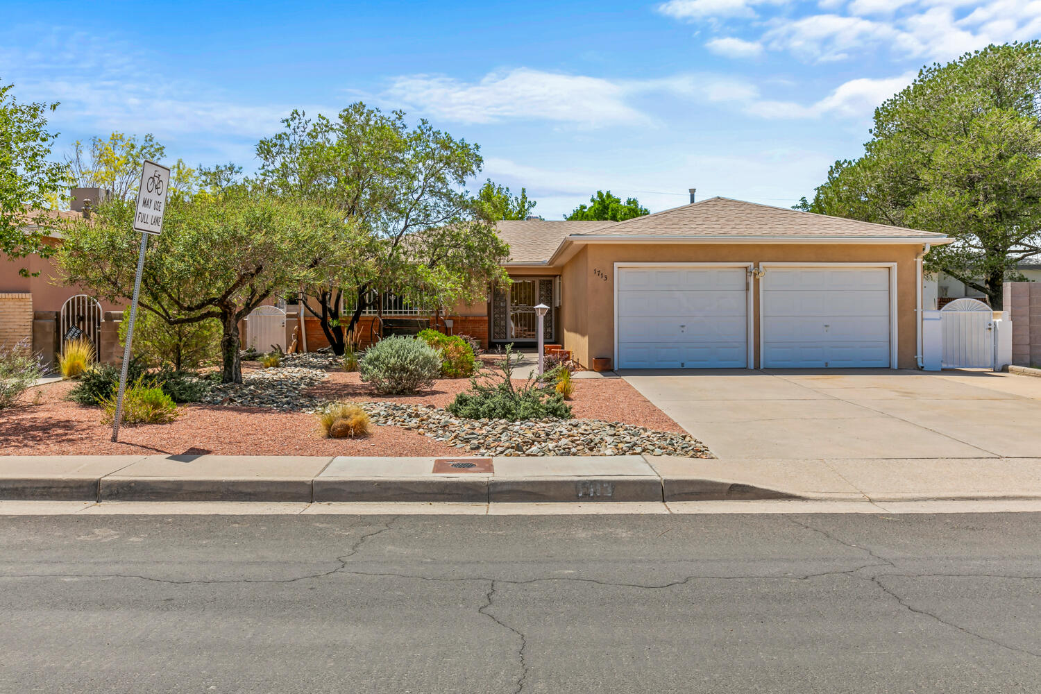 Opportunity KNOCKING! Nicely updated home in convenient location minutes from Coronado Mall business district & I-40.  Owner has completed many updates  including: installing kitchen island(storage & seating), granite kitchen counters, S/S sink with matching faucet, vinyl windows (including the sunroom), remodeled primary bath shower, wood look tiles in kitchen & professionally landscaped front & back yards.  Functional floorplan with 2 living areas and a wood burning FP. EZ care laminate floors & 2 rooms with original hardwood flooring.  Lrg dining room + open kitchen is entertainers dream. Laundry room has plenty of storage.  Plus a finished garage with coated flooring is a nice finishing touch.Just unpack and start living in this special home. Make appointment to see it today!