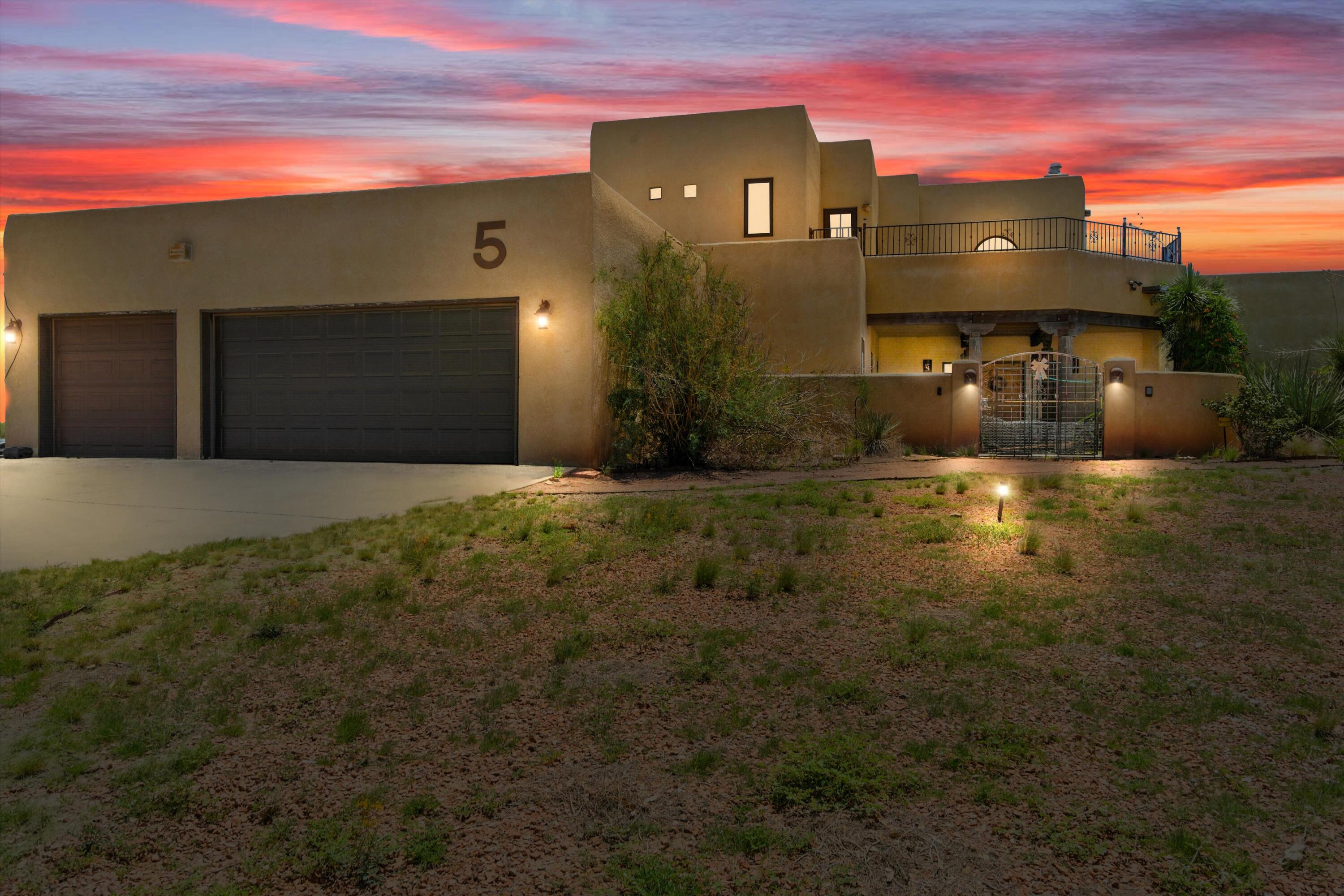 Welcome home to this beautiful custom home situated on a 1/4 acre lot in Los Lunas. Enjoy plenty of space with 2900+ sq ft, which includes 4 bedrooms, 3 bathrooms and a loft. The home features 19ft ceilings in the main living room, 2 gas fireplaces, balconies with stunning views, REFRIGERATED AIR, a luxurious primary bath, and more! If you are looking for a home away from the hustle and bustle of the city, this one is for you! Schedule a tour today!