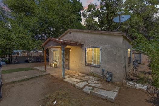 Welcome to this charming Albuquerque home with endless possibilities! This fully gated property offers both security and convenience, with backyard access. Alongside the main house, a versatile guest house awaits in the backyard. This additional space opens doors to endless possibilities - an art studio, home office, or a cozy retreat for guests. It offers privacy while remaining connected to the main property. Imagine the convenience and creativity this space can bring to your lifestyle. The main house features two spacious bedrooms and a cozy dining room, all kept comfortable year-round with refrigerated air. Situated near the scenic Rio Grande River! Don't just buy a home; invest in a world of opportunities with this unique house at your disposal.