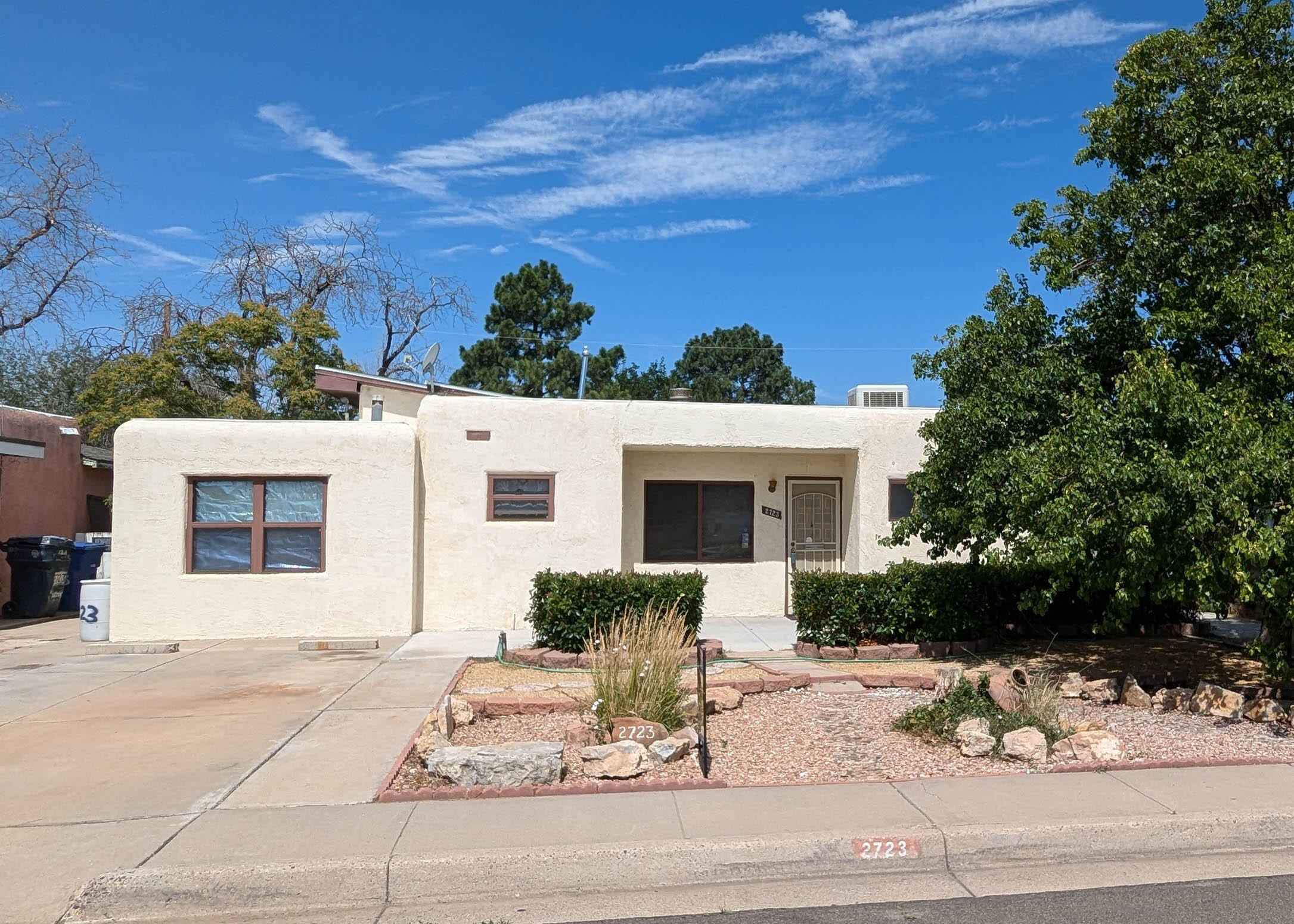 Located in an established NE neighborhood this 2 bedroom, 1 bath home has a huge living room with high ceiling, lots of windows, three ceiling fans and gas fireplace. There is a second smaller living area that could be used as den/home office or study. Home has detached guest house with divided living and sleeping area, bathroom and kitchenette. Guest house has refrigerated air and heat pump. Front yard has xeriscape, shrubs and tree. Fenced backyard has English Ivy/Silver Lace walls, lawn, shrubs, tree and large patio, storage building and gated access from alley. Main house has new water heater (March 2024) and mini-split heating/cooling in main living room (April 2024).