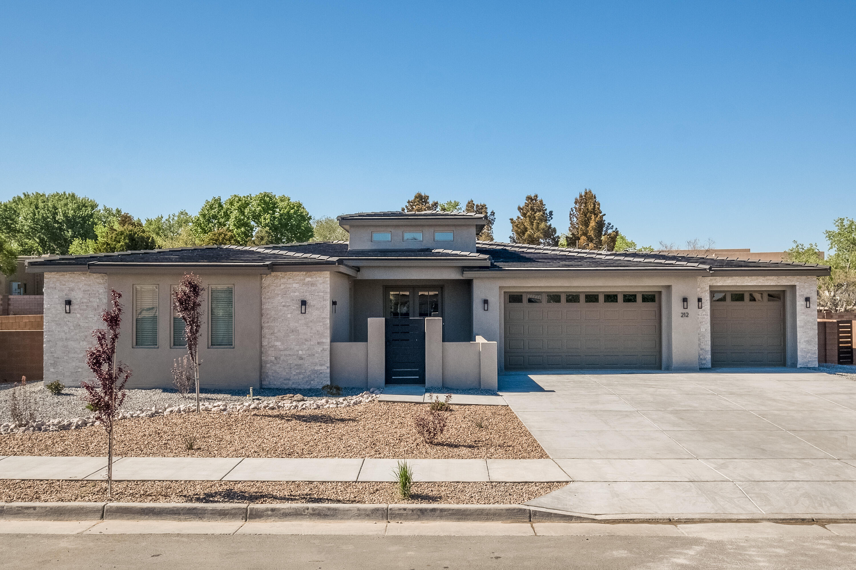 This beautiful home in the small, gated community of Lavendar Estates in the North Valley is a true gem. Lots here are all large and the beauty of the valley is enhanced by the privacy of entry gates and large lots. This home sits on a 1/3 acre lot with a 3-car garage with plenty of room to spread out. The thoughtfully designed floorplan has been beautifully appointed with all custom, designer-selected finishes. Four bedrooms accommodate your family and guests and a large flex space (heated and cooled) is waiting for you - do you desire a theater room? an at-home office? a place to store your treasures? or just a great area for the kids to hang out in? This flex space at 21' x 12' space is perfect. The owner's suite features a coffered ceiling, large walk-in closet, separate shower and t