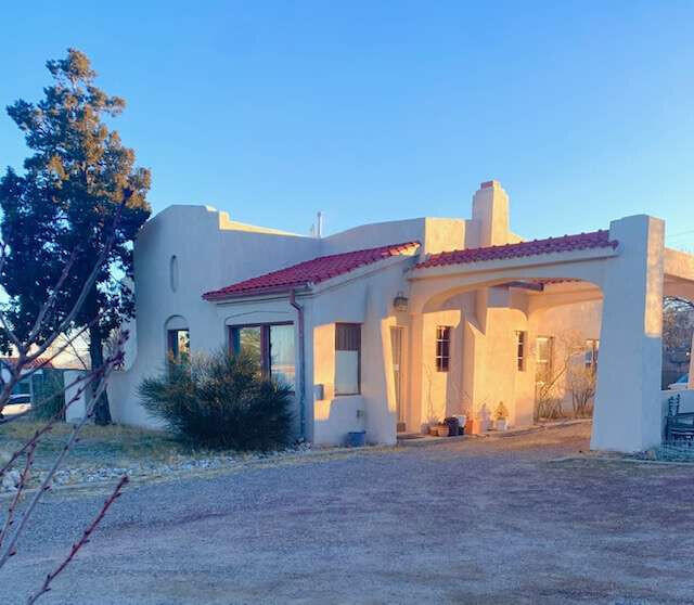 Welcome to a historical home with abundance of architectural charm on top of Nob Hill! In the heart of Albuquerque's premier walking/biking neighborhood w restaurants, shops, movie theaters. This 1920's home has a stunning addition with 2nd fireplace, 2nd Kitchen, 12' ceilings, huge windows w colorful views of sunset reflection on Sandia Mts. Perfect for ARTIST/MUSIC studio & entertaining. Home has large formal entry with French doors to the living room, with original tile fireplace, hardware, cove ceilings. Formal dining room opens to porch w sunset views. Beautiful hardwood floors. Double Garage! Income: Infrastructure set for easy division to duplex. Short drive to Netflix Studio. Drive/walk UNM, UNMH. Create your dream oasis in private yards on .31 acre, endless possibilities!