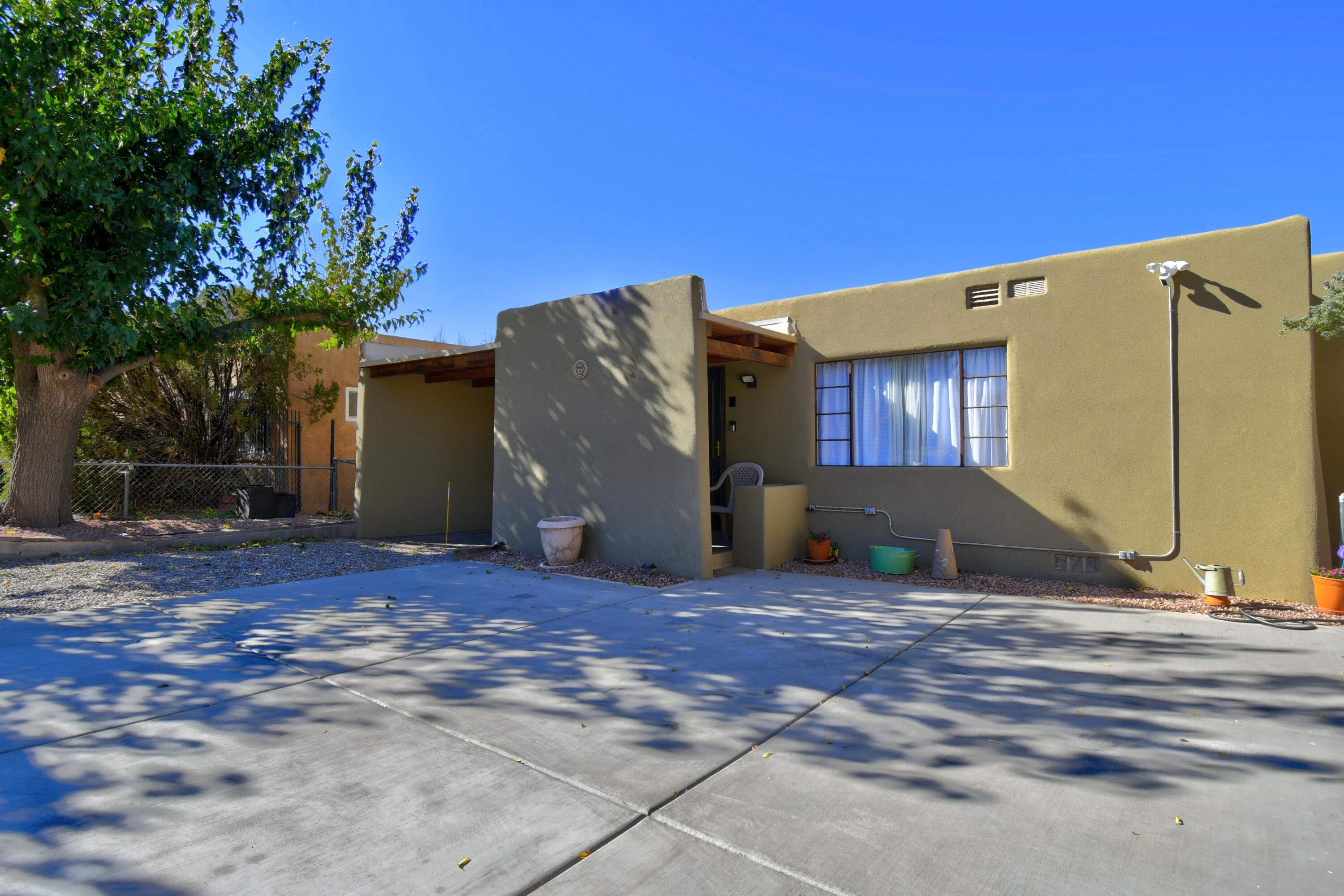 This beauty is centrally located in the area on UNM/Nob Hill. Updates include New Roof, New Synthetic/fiber Stucco, New Flooring, Upgraded Electrical Panel, New Central Duct work, New Furnace and Cooling System, New Concrete Driveway, remodeled bathrooms w/new toilets, Remodeled kitchen, Reinforced foundation block pillars in crawl space, New Paint throughout. Beautiful Patio for cooking and grilling. BACKYARD ACCESS!  RV parking w/sewage lines for RV or future unit(s). Centrally located to UNM, stadiums, parks, libraries, restaurants, shopping in downtown ABQ! -Schedule your showing today!