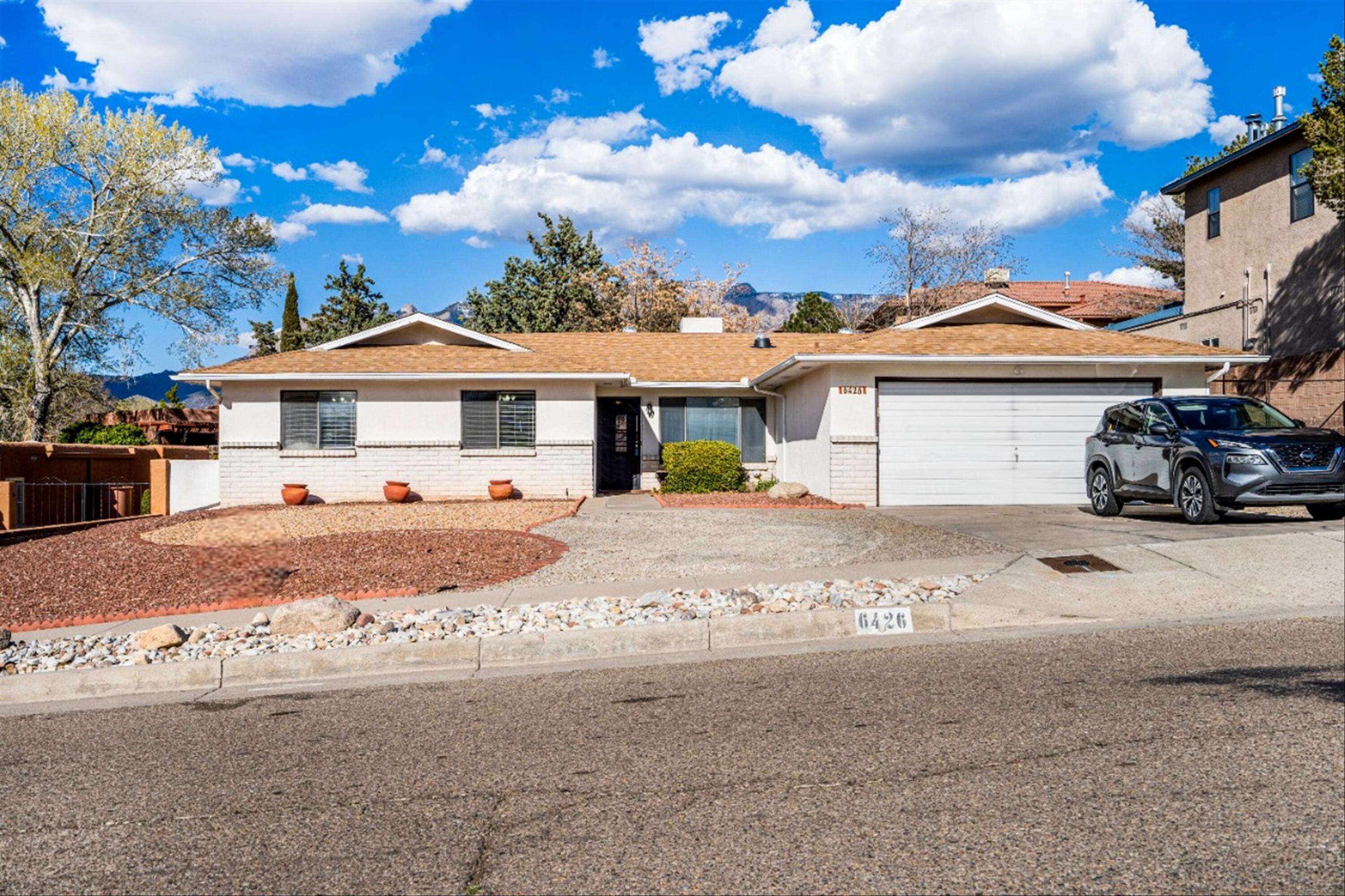 Beautiful, single story home in desirable NE Heights! Great Neighborhood with FANTASTIC neighbors! Excellent location close to schools, parks, shopping, and foothill trails!!! Pride Of Ownership: Two Living Areas, Four Good Sized Bedrooms, 3 Bathrooms, 2x6 construction, Hot Water Baseboard Heat, MasterCool A/C, Skylights, Tile floors throughout, Security Door, Immaculate Condition!! Washer & Dryer to convey with sale.