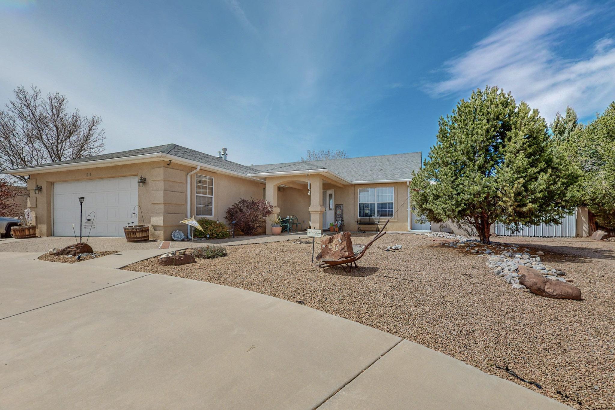Here is the one you have been waiting for! A custom ranch on 0.5 acre in one of the most desirable neighborhoods in Los Lunas. The open floorplan is light and bright offering so much space to gather and enjoy time with friends and family. Raised ceilings, newer flooring, nearly new cooktop in the kitchen and a sunroom are all wonderful features. A finished 24x30 detached garage/workshop plus 20x30 carport are in addition to the attached 2 gar garage, making this a dream for the hobbyist needing space for toys, projects, storage, etc. Backyard access and huge backyard with trees, grass, and a large open patio. Mountain views from the fully landscaped front yard are gorgeous!