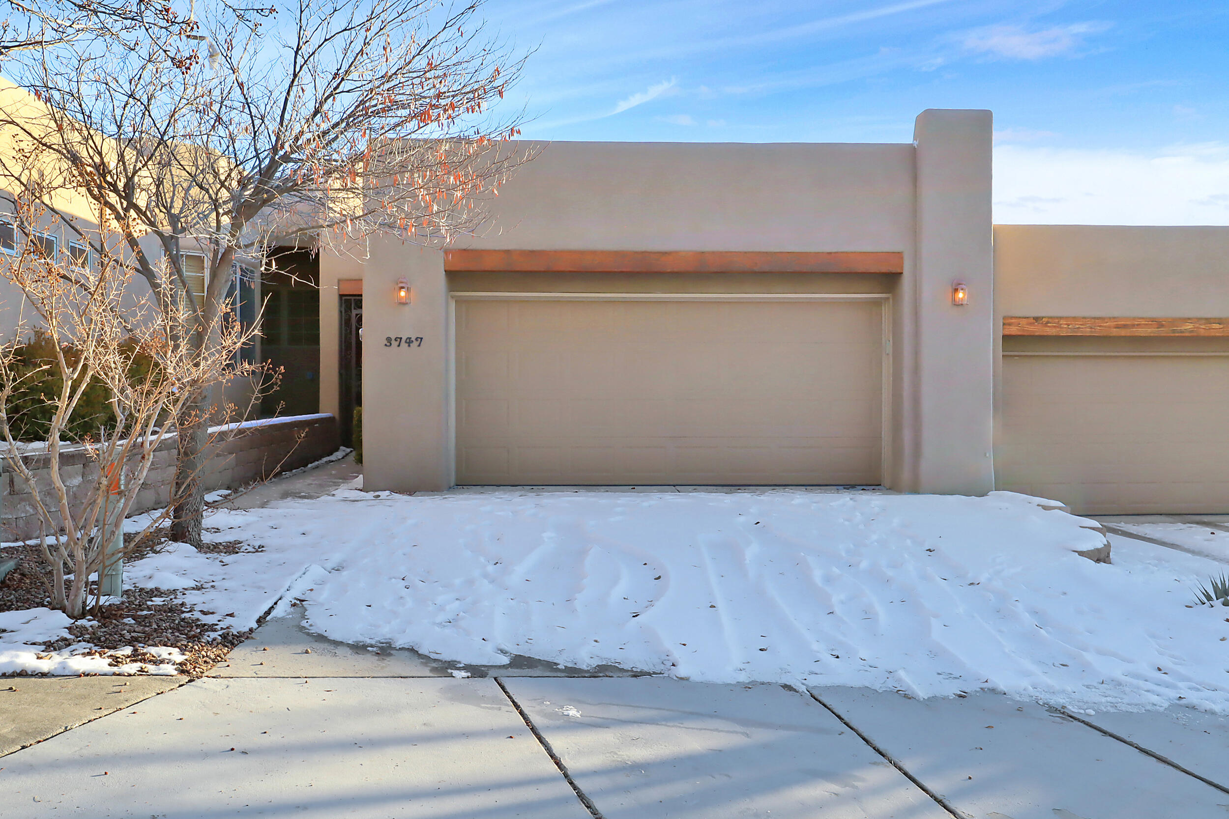 Explore the epitome of comfort in this meticulously designed 2-bed, 2-bath single-story home perfectly located by the Sandia Mountains. Skylights bathe the interior in natural light, highlighting a spacious living/dining area that seamlessly connects and features an integrated office nook for added convenience. Venture into the backyard oasis, where a covered porch beckons outdoor relaxation, and a raised flower bed showcases the beauty of mature roses and a fragrant honeysuckle bush. The garage, boasts a pristine epoxy surface, adding a touch of luxury to this well-maintained space. This home invites you to experience thoughtful design and practical elegance, creating a haven where every detail contributes to a lifestyle of convenience and tranquility, so schedule your showing today!