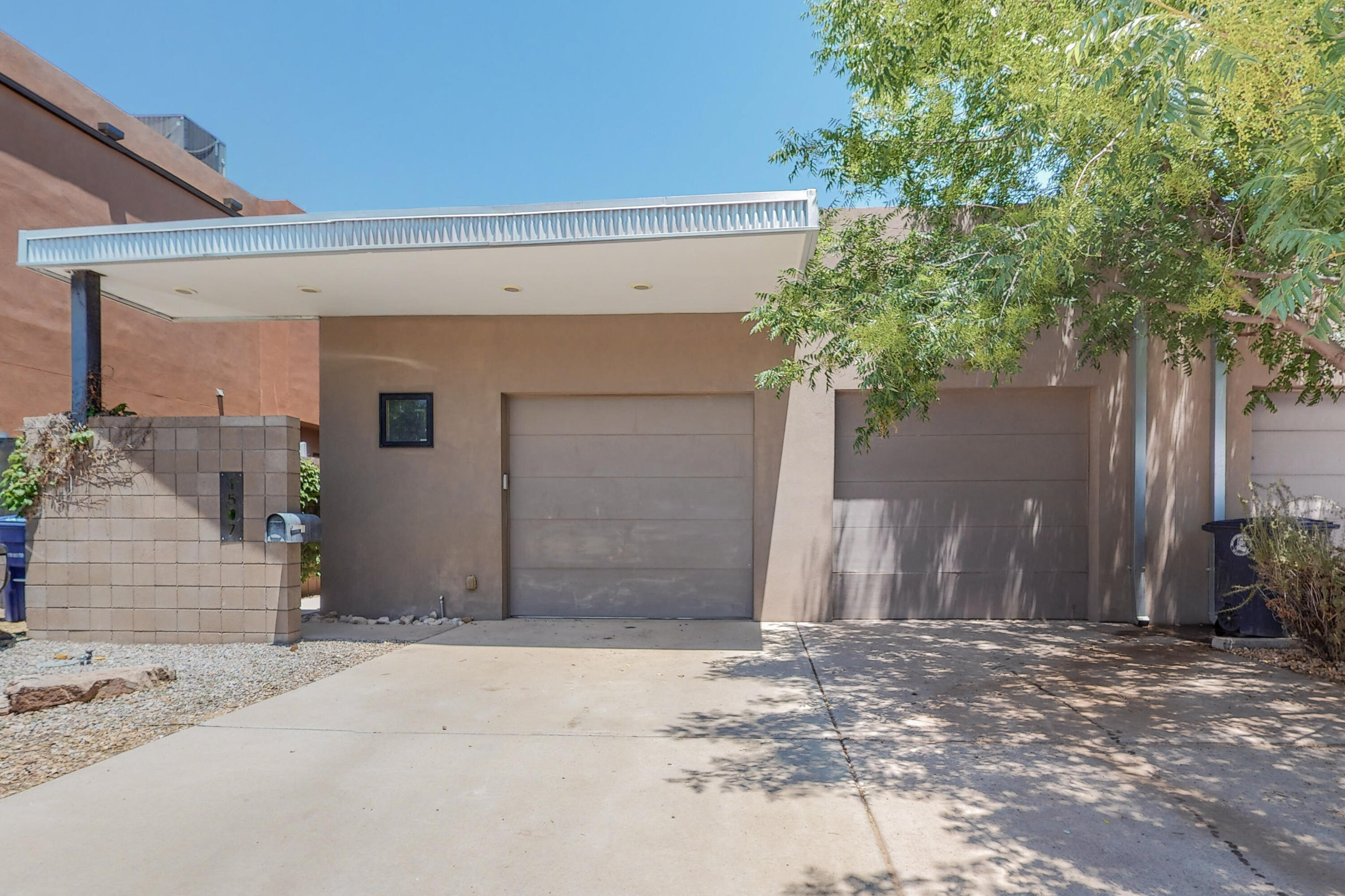 Discover the epitome of Albuquerque living at 1507 San Patricio Ave SW in the historic Huning Castle neighborhood. This 4-bed, 2.5-bath home exudes modern elegance with high ceilings and new vinyl flooring. Large sliding glass doors bathe the interiors in natural light, complementing the cozy ambiance of the gas fireplace. The kitchen, a culinary haven, boasts a breakfast bar area, tons of space, and a beautiful open floor plan. The master suite features an amazing walk-in closet. Ideally located, enjoy quick access to Old Town, Tingly Beach, the Country Club, the Zoo, and downtown--all within 5 minutes. With a seamless blend of historical charm and contemporary comforts, this residence is a unique opportunity to call Albuquerque home.