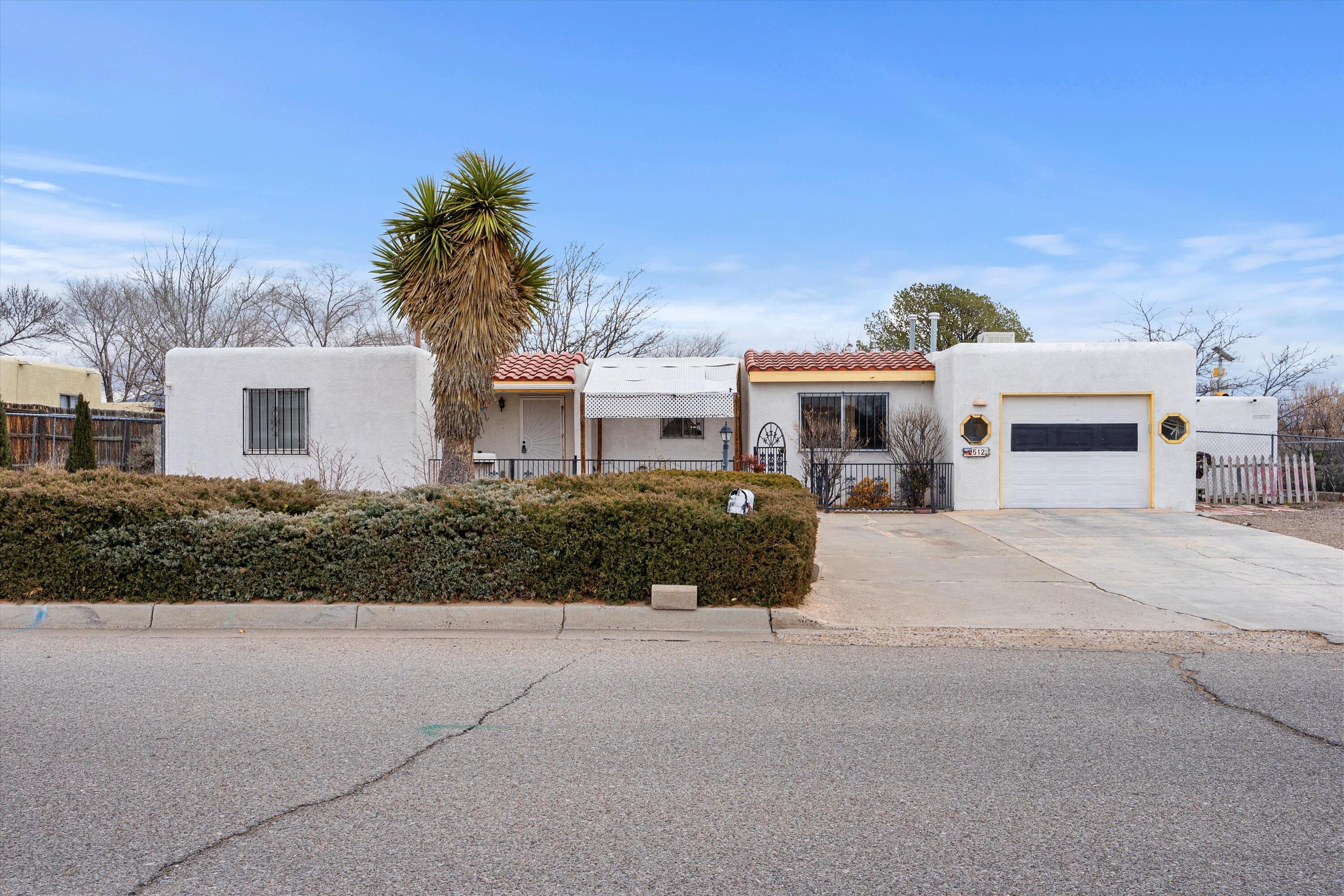 Lots of potential on this Corrales Heights home.  Large corner lot with backyard access.  Show and sell today!