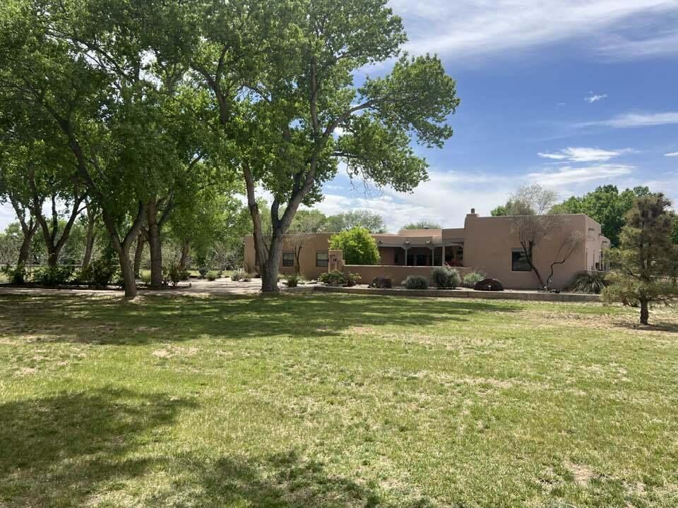 Beautiful custom home in the highly sought after Bosque Farms area. This country oasis sits on 2.81 acres of mature landscaping with tall cottonwood trees. It has pipe fencing with automatic gate entrance. There is also a barn for horses, livestock or smaller farm critters. Immediate access to ditch bank riding and close to ride on the Bosque. Exclusive quiet neighborhood, yet easy access to shopping, dining and quick commute to Los Lunas or Albuquerque. This house has too many high end upgraded features to list. Don't hesitate to schedule a showing before it's gone. Contact listing agent for gate code or to schedule a showing.