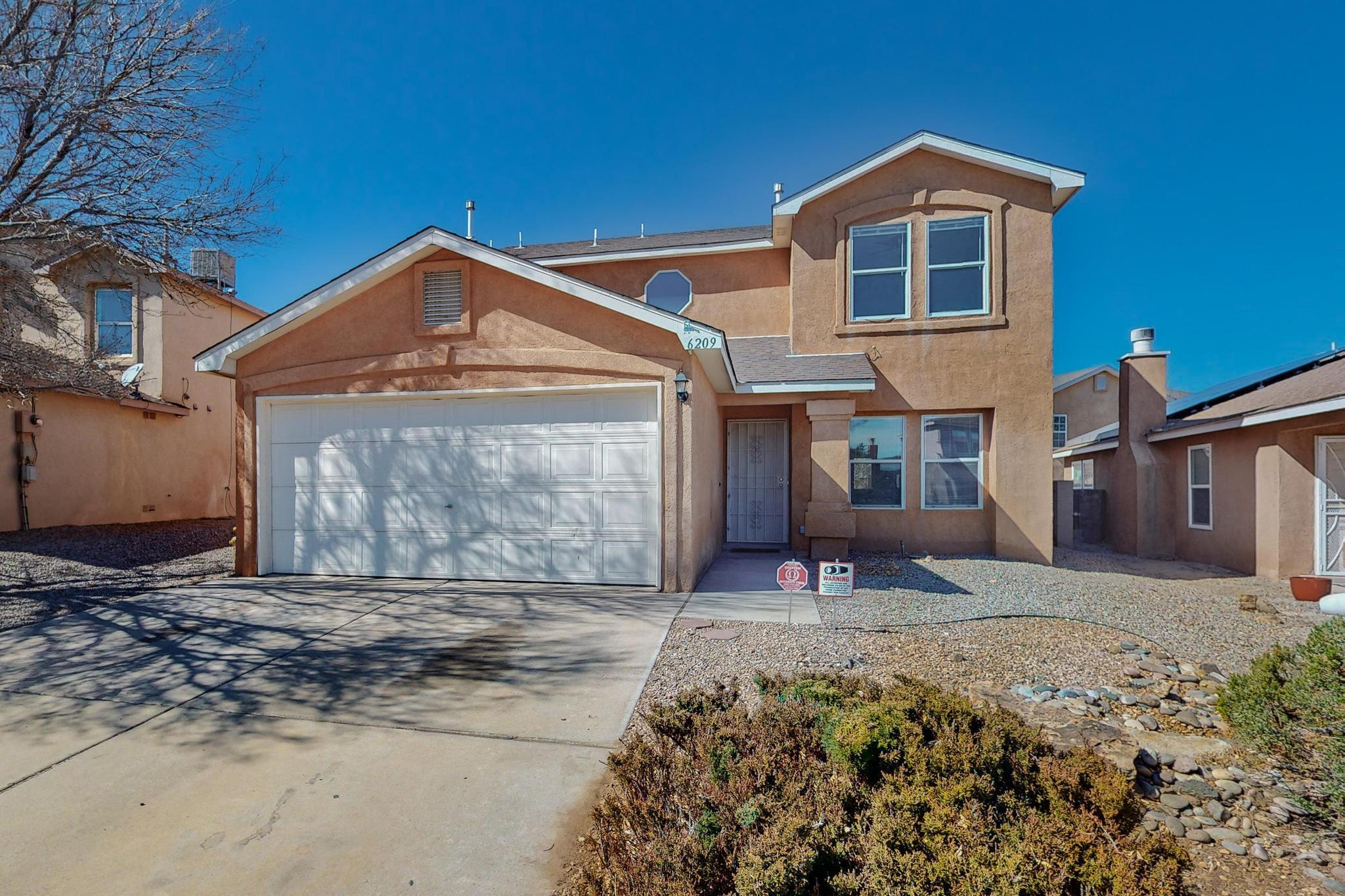 Welcome to this beautiful home in the desirable Sedona at Ventana Ranch neighborhood. Over 2,000sf with 3 bedrooms, 2.5 bathrooms and a 2 car garage. The large open floor plan is perfect for entertaining with wood laminate flooring in the living/dining/stairway and tile in the kitchen with lots of natural light though out. The pellet stove is a perfect compliment for those chilly evenings. Welcoming bright and open primary suite with french doors, walk-in closet, soaker tub with separate shower and dual sinks. Enjoy views of the Sandia Mountains from Bedroom #2. Brand new carpet in bedrooms!