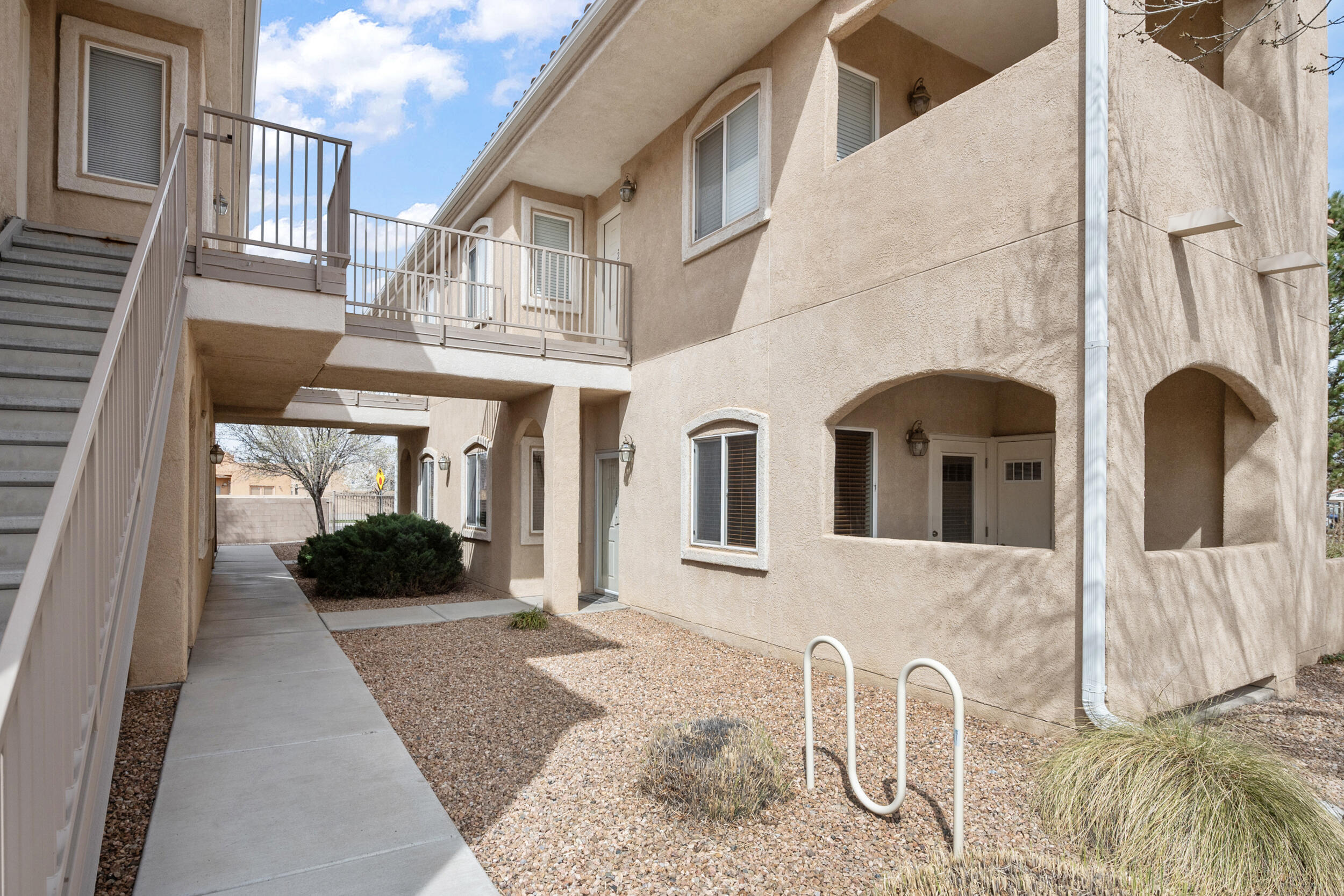 Ground level unit in the highly sought after Vista Del Norte gated community. Great location right next to the clubhouse/pool and across the street from the park. This condo has been well taken care of. Updated laminate flooring throughout the living areas and newer appliances in the kitchen. New dishwasher (2 years) and newer water heater (2020).  Private garage space and designated parking spot right in front of the unit. HOA covers the clubhouse, gym, community pools, security, exterior of residence, front landscape and more! Schedule your showing today!