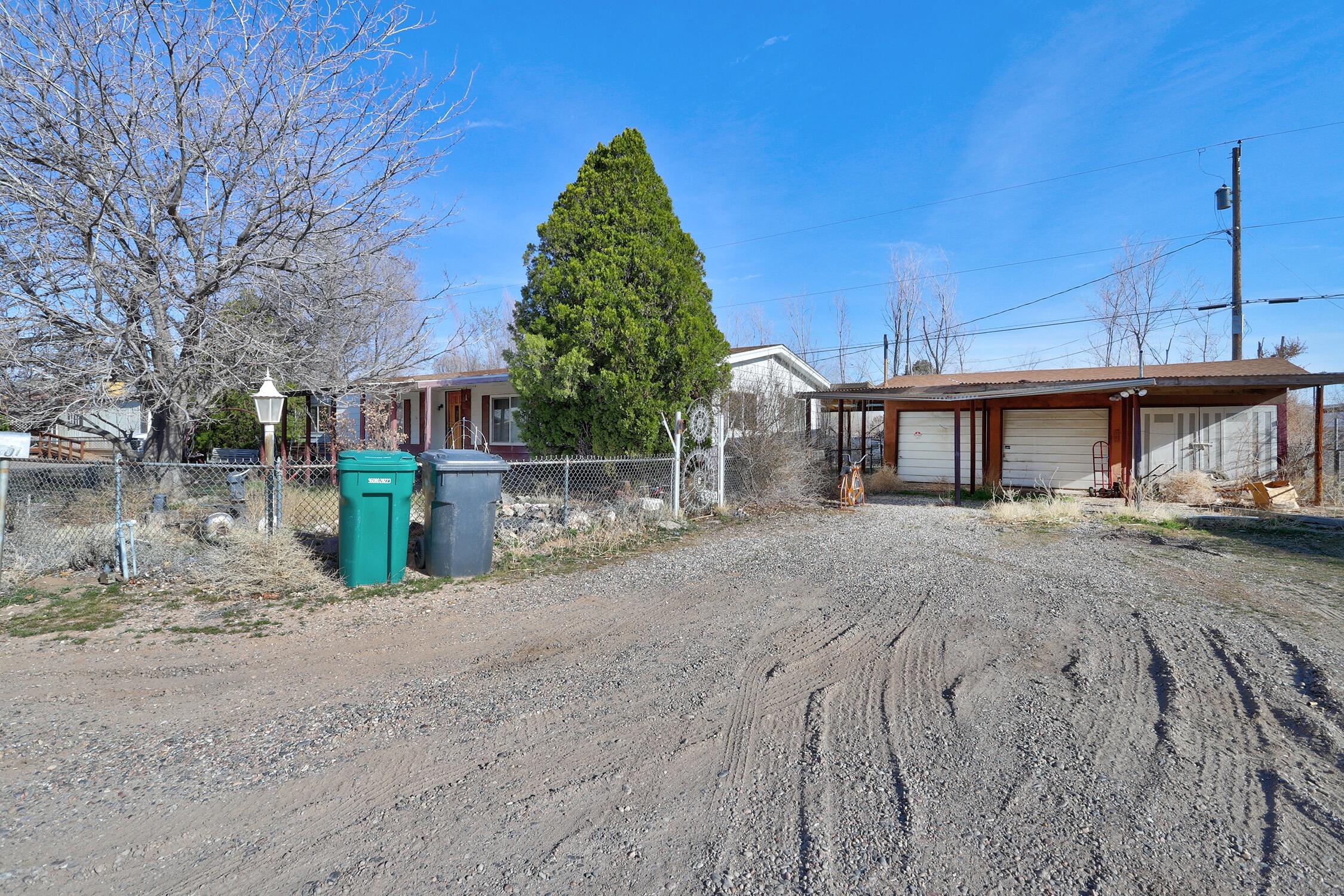 Welcome to Los Ranchos! This 3 bedroom, 2 bathroom home has tons of potential! This 0.25 acre lot has fantastic location on dead-end street, near Bosque trails and fabulous restaurants/amenities. 724sqft bonus room not included in sqft! 3 car detached garage with 3 car carport.
