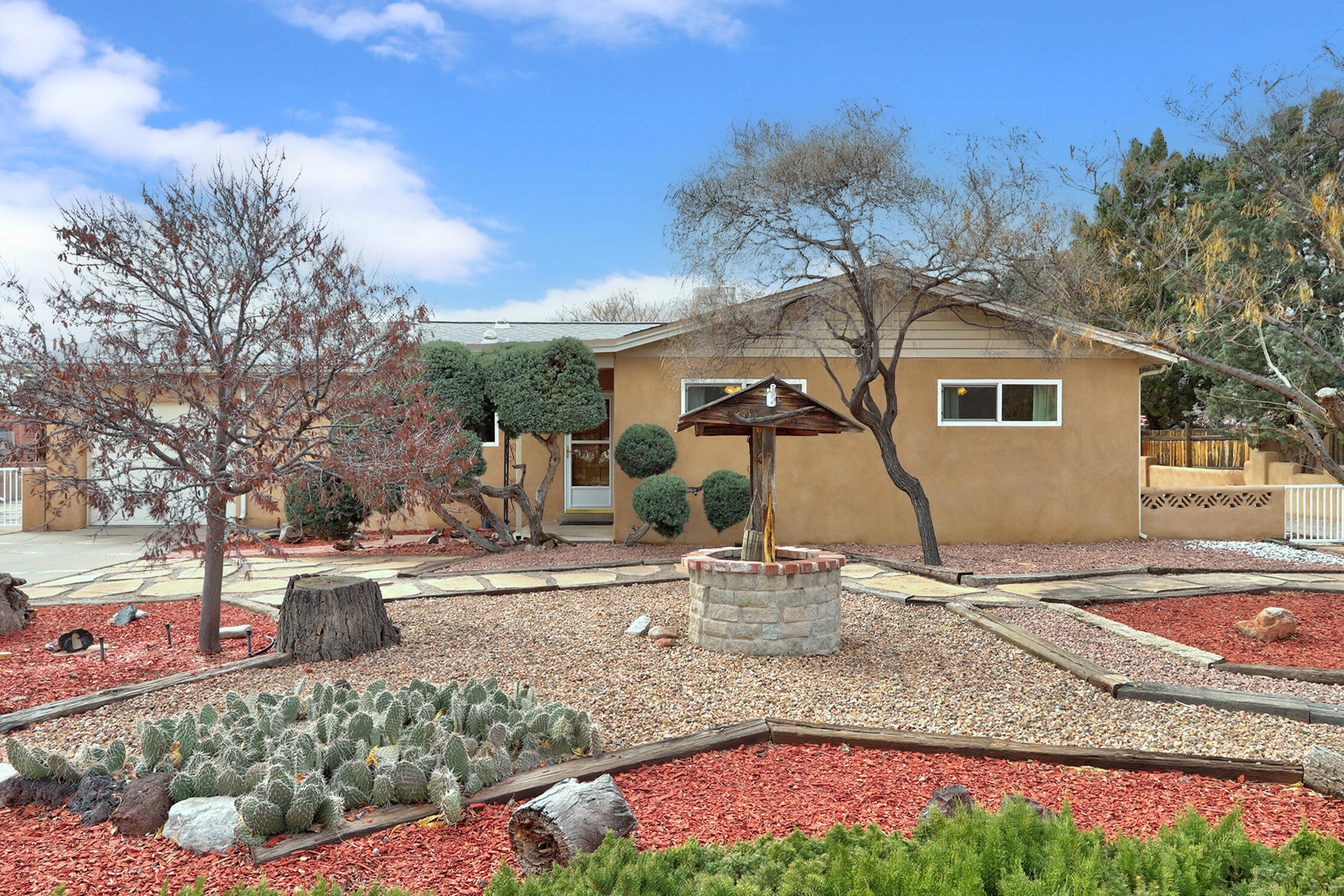 Ask your realtor to tell you about seller concessions being offered on this updated 1960's ranch style home in the heart of the north valley. Backyard access to the west end of the property, ready for a casita to be built if you desire!Walk in cedar closet in the oversized primary suite, jetted tub in primary bath, ceiling fans, an open kitchen/dining area with a large island with enough room for both meal prep and informal dining. Great curb appeal, fully landscaped with drip watering system, living room with gas fireplace, enclosed back sunporch and nice backyard landscape. There's a cute shed in the back parcel of the property. Peaceful neighborhood with easy access around town. Close to restaurants, supermarkets, the Los Poblanos open space, and the revitalized 4th street corridor