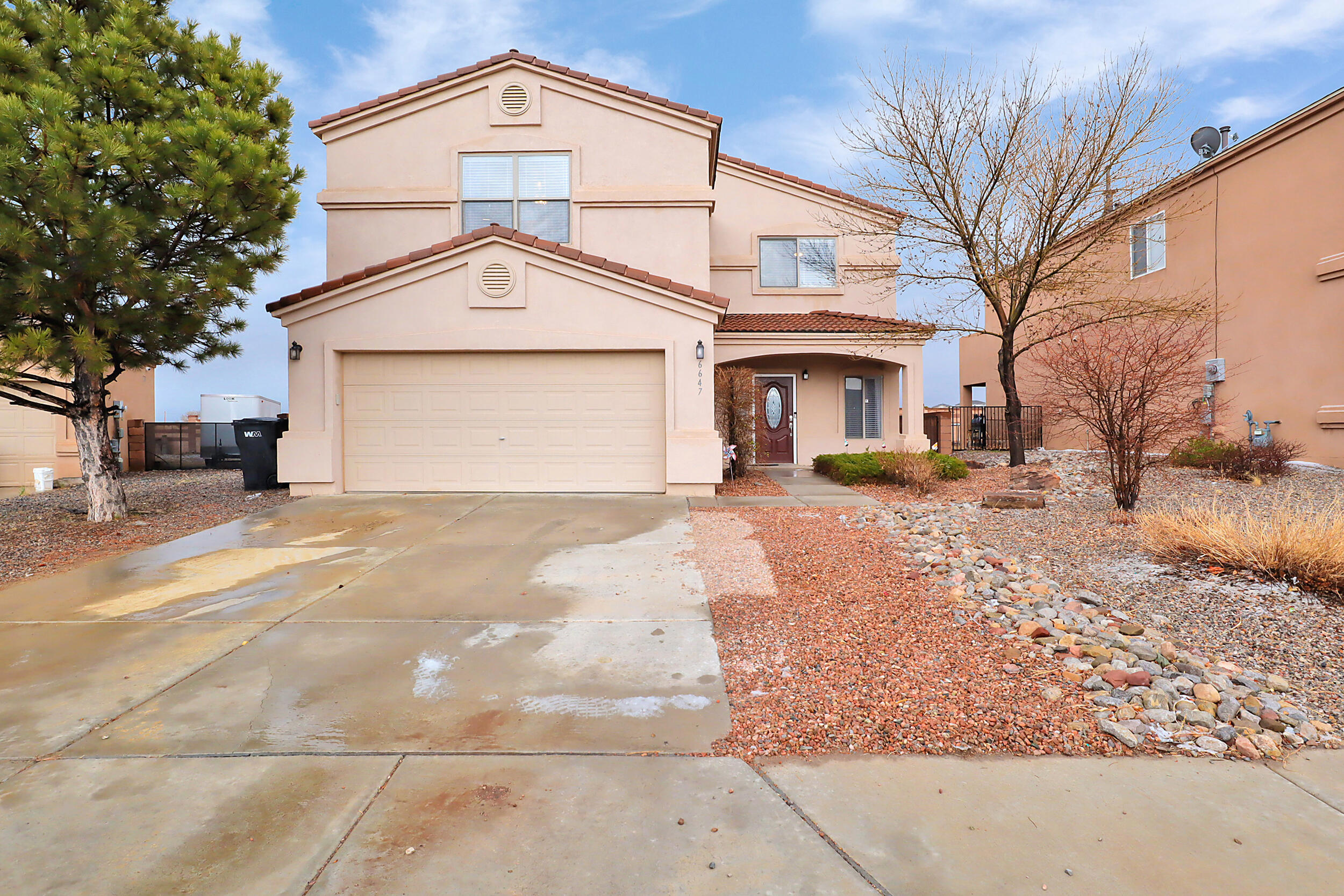 Check out this new listing in Rio Rancho, nestled within the V. Sue Cleveland High School District in Mountain Hawk Subdivision. No HOA or PID & home is completely CARPET FREE! Step through the front door to be greeted by new LVP flooring in both living areas & fresh paint. 2 great rooms provide ample space for entertaining. 2 fireplaces in the home (in the family room & two-way fireplace in the primary bedroom/bath). Kitchen equipped w/ stainless steeled appliances & walk in pantry/laundry room. The upper level includes a loft & 3 guest bedrooms & primary suite. French doors open up to the primary suite which features a balcony to enjoy the views. Primary bathroom includes a jetted tub, shower, double sinks & walk in closet. Backyard is completely walled for privacy. Welcome home!