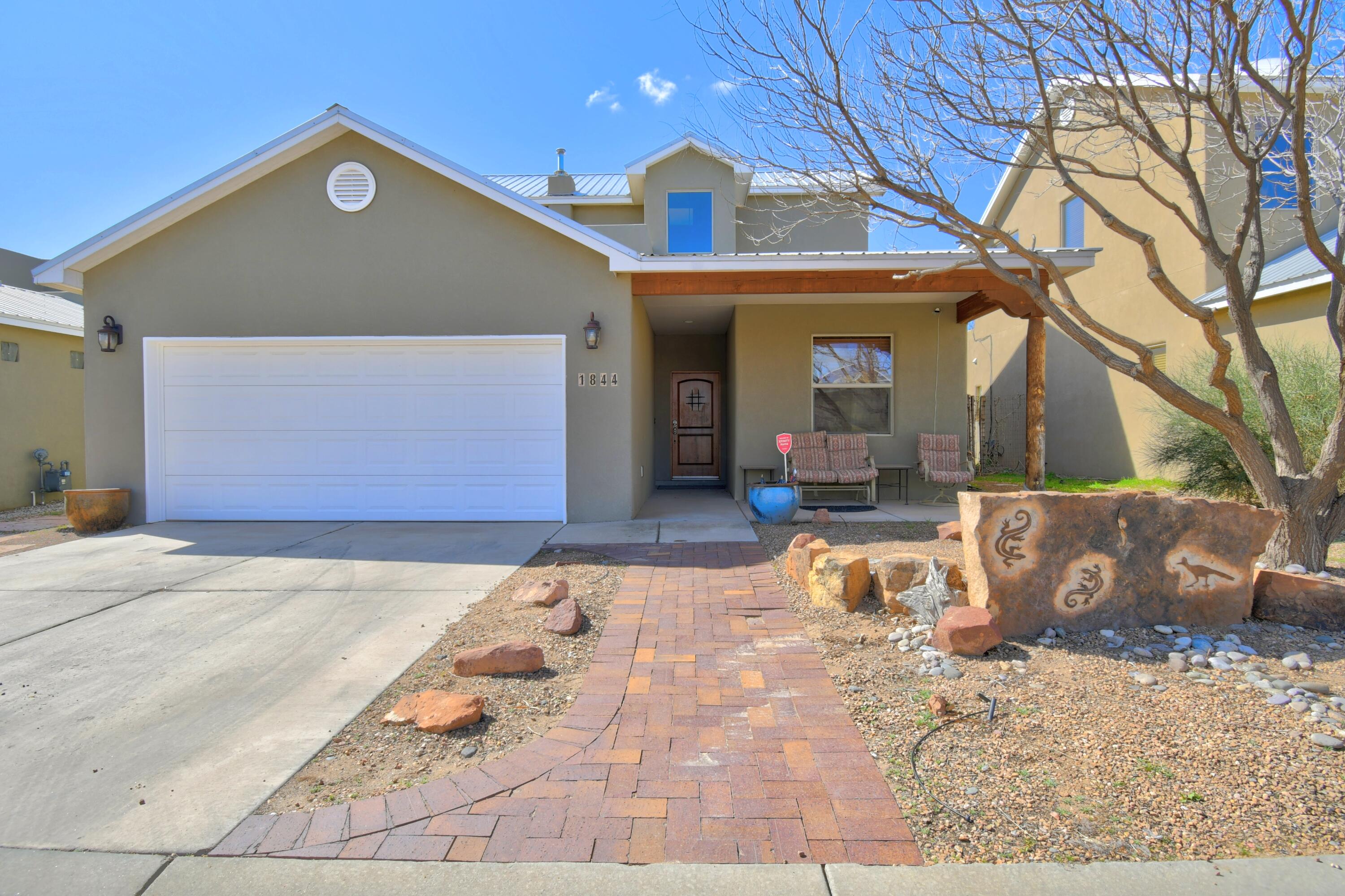 UPSCALE, wonderful offering in the coveted Villa de la Capilla enclave, along the Rio Grande corridor. Winning floor plan & charm combine to make this a wonderfully versatile home, filled with southwest accents, built ins and wood paneled doors.  Open concept GREAT ROOM with GOURMET KITCHEN, large pantry, quartz counters, stack stone fireplace and lots of windows to enjoy the patio and backyard from the inside. Lovely wood floors. Refrigerated air! (New combo unit to be installed prior to closing.) Very special & intriguing Master oasis, all it's own!   2nd floor front deck enjoys a view of this inviting North Valley enclave.  Not far from the Nature Center, Old Town, Los Poblanos, Flying Star, fun Los Ranchos trails and so much more.