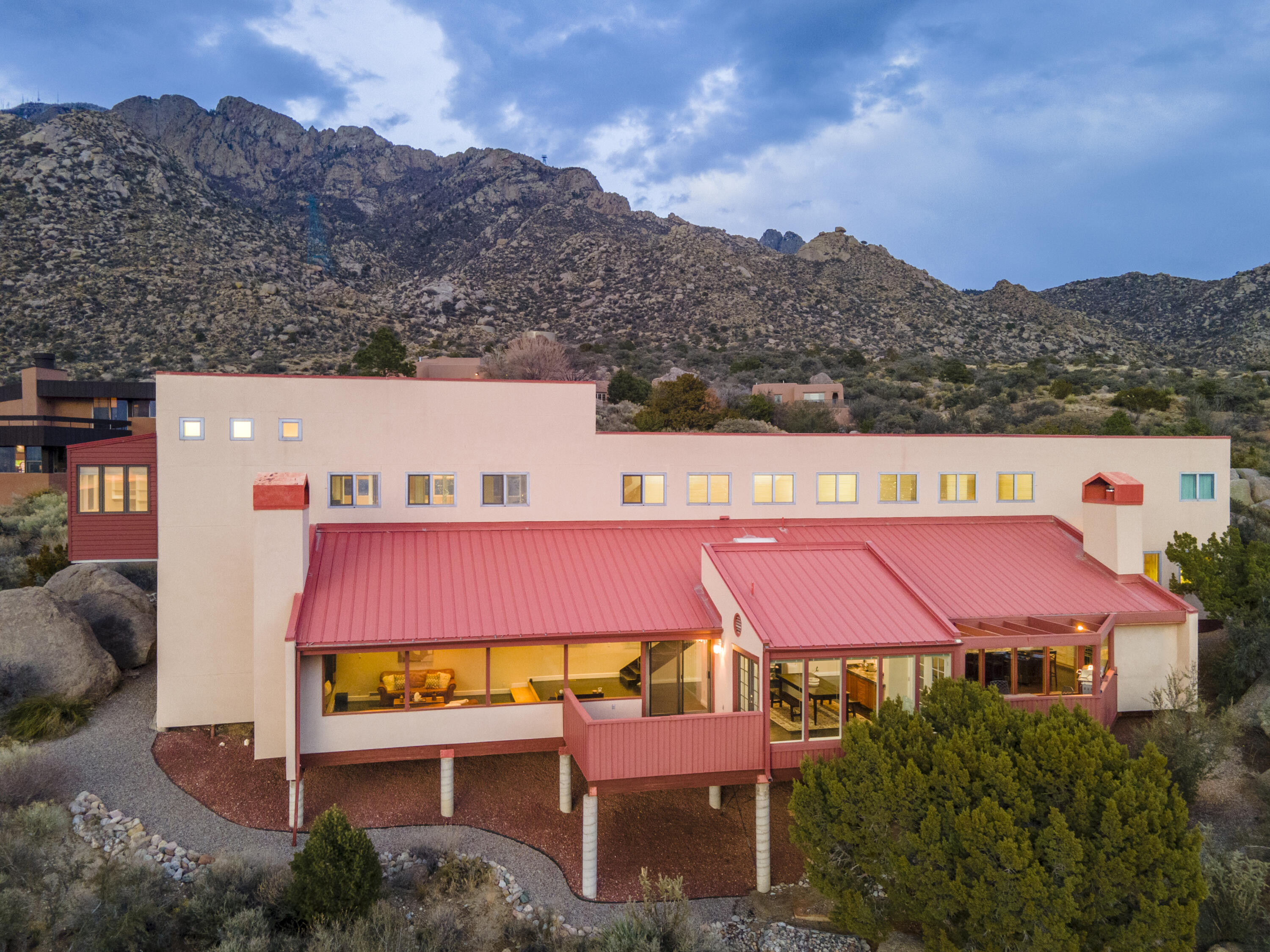 One of the best VIEW lots in SANDIA HEIGHTS. Custom Ron Romero multi-level home provides some of the most exquisite VIEWS of the city & Sandias that ABQ has to offer. Updated & upgraded throughout with 4bdrms + office & 4 baths. As you enter the foyer, the wall of windows greets you with phenomenal CITY VIEWS! The living area with gas insert FP is open to the gorgeous updated kitchen: 60,000 BTU professional range, Euro cabinets, granite and butcher block countertops and large island. Primary suite is its own sanctuary with an enclosed hot tub room that is surrounded by gorgeous MOUNTAIN VIEWS! Secondary bedrooms are truly unique with two offering large lofts. All baths have been completely updated. 3 car garage. Landscaping by Hilltop. 500ft from trails for amazing hiking and MTN biking.